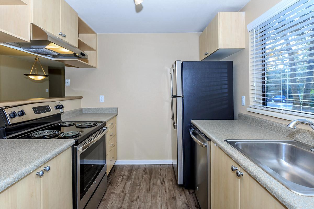 a modern kitchen with stainless steel appliances