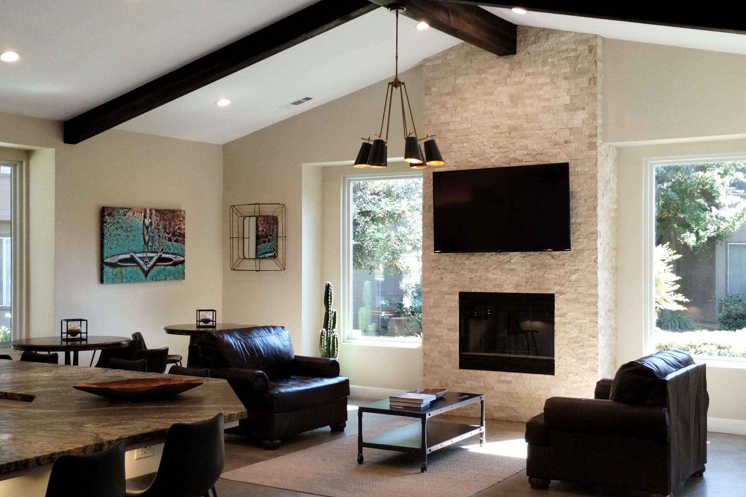 a living room filled with furniture and a flat screen tv