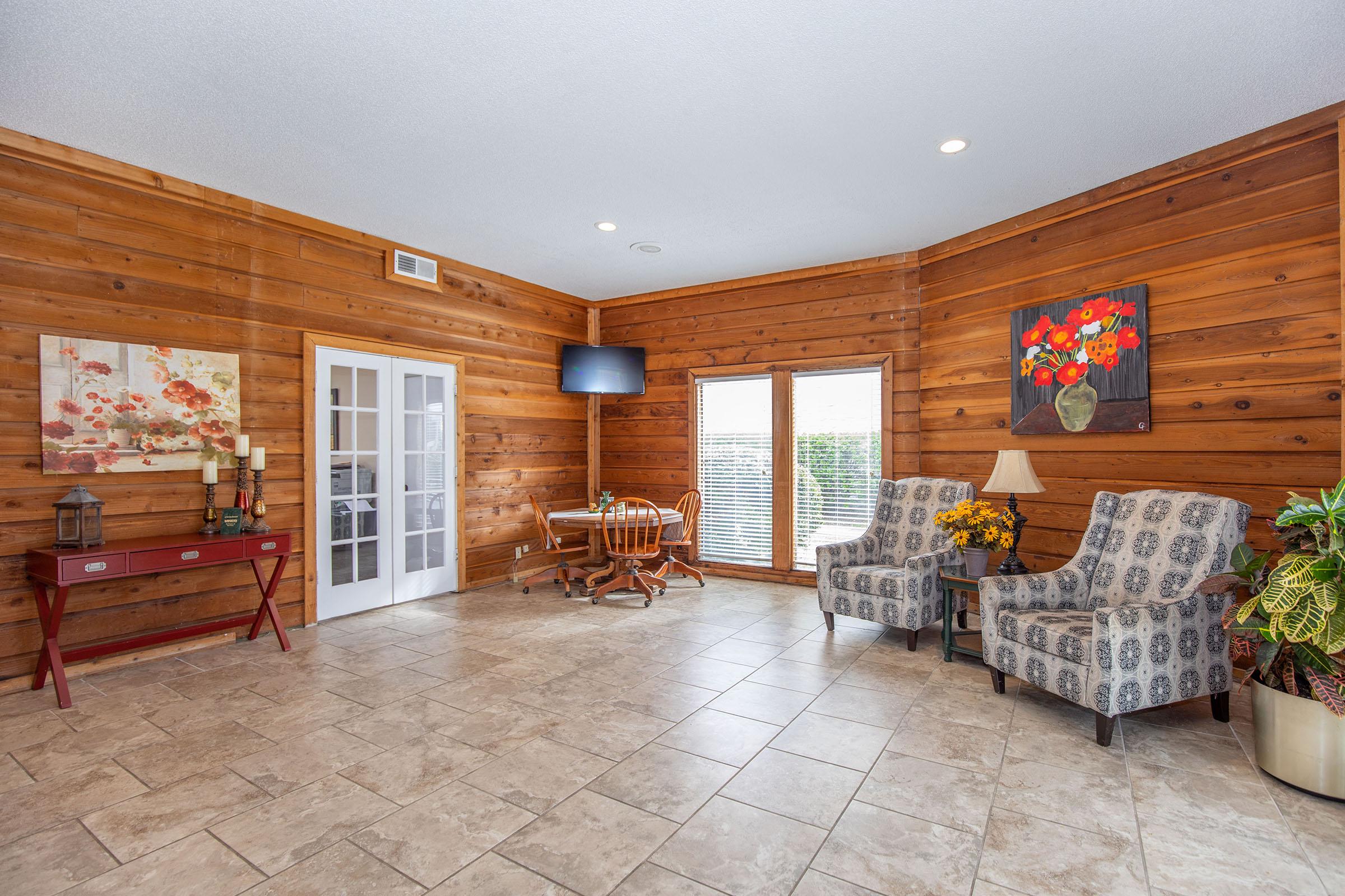 a living room filled with furniture and a fireplace