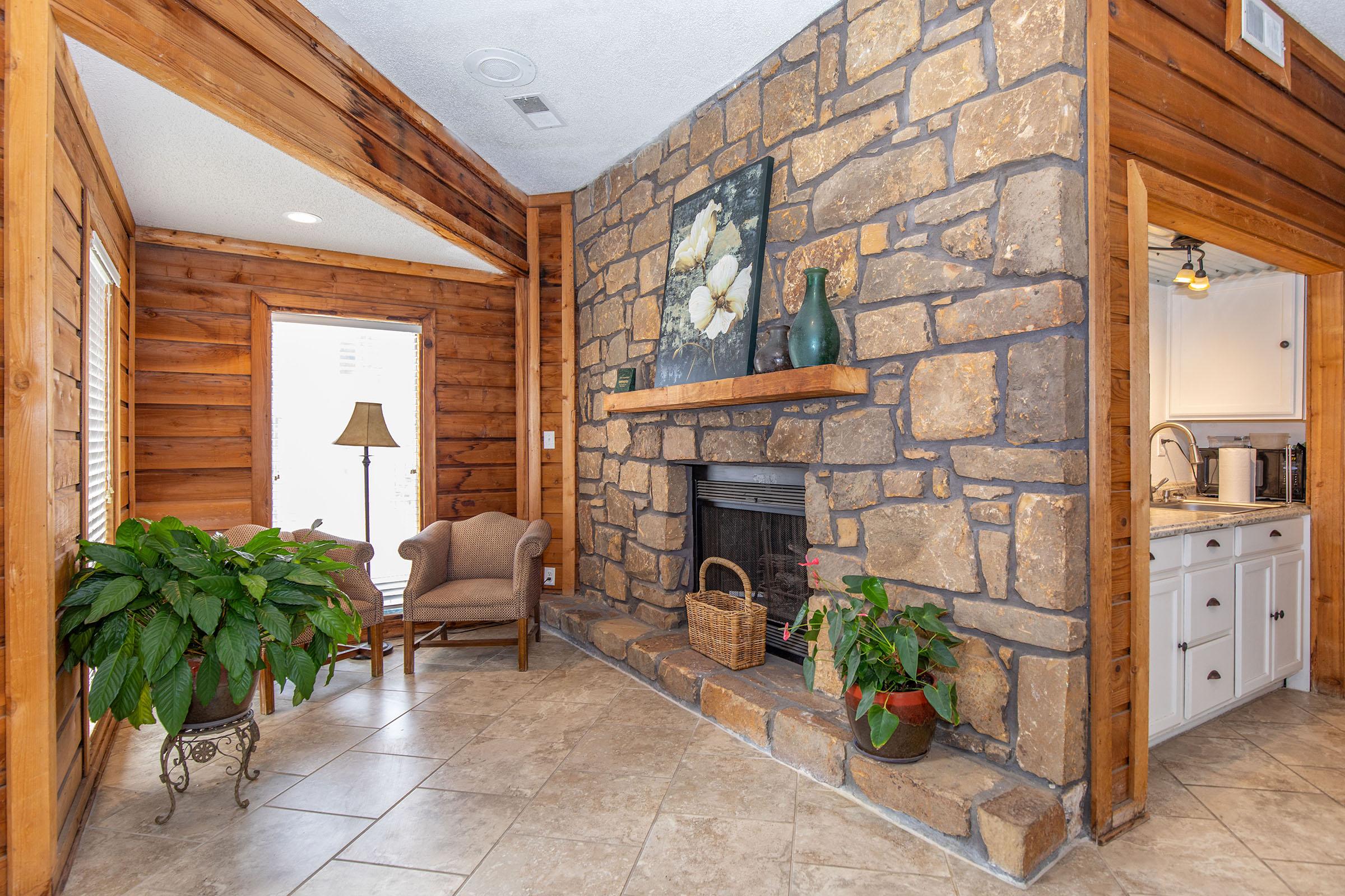 a living room filled with furniture and a fireplace