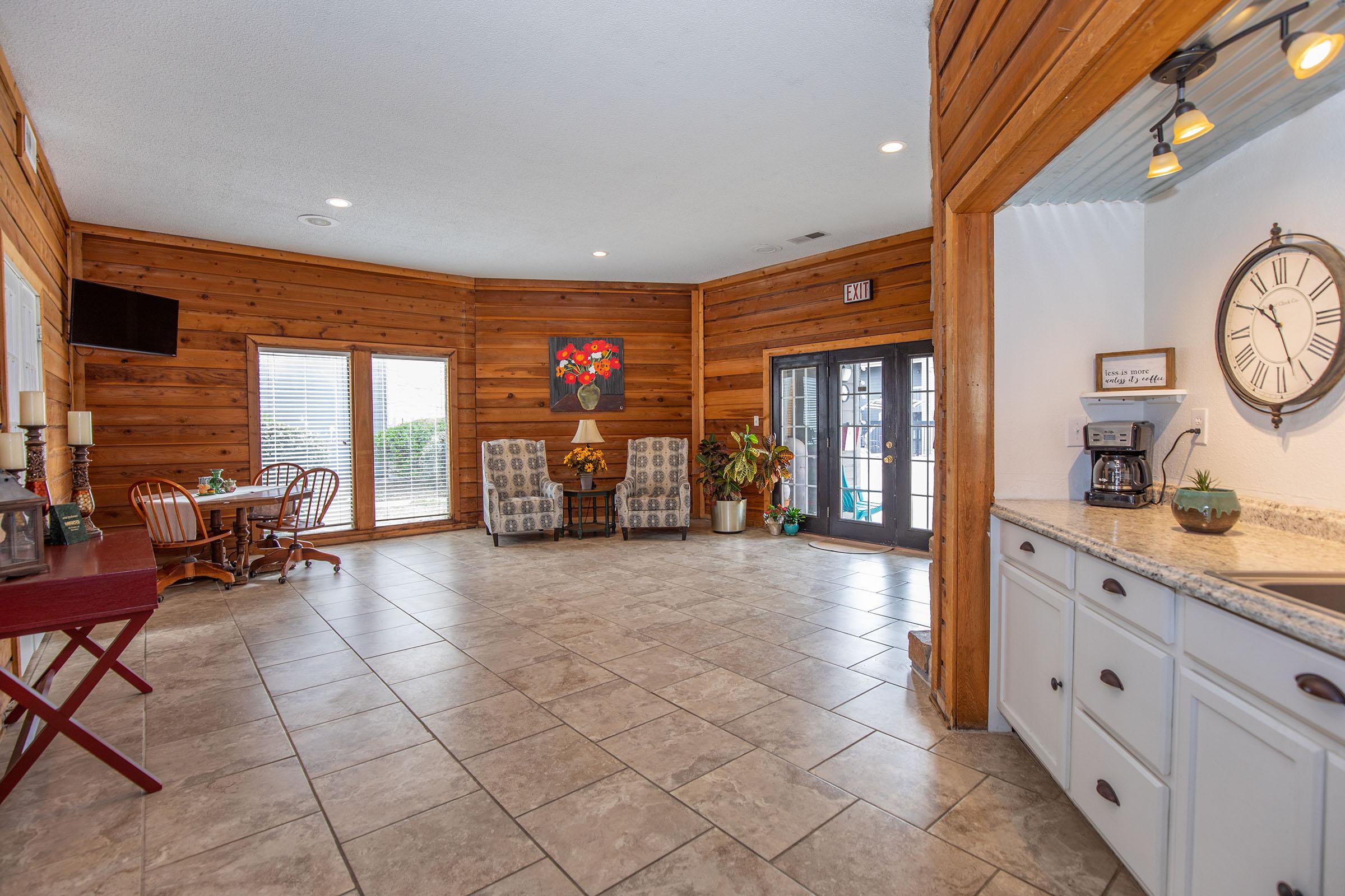 a kitchen filled with lots of furniture