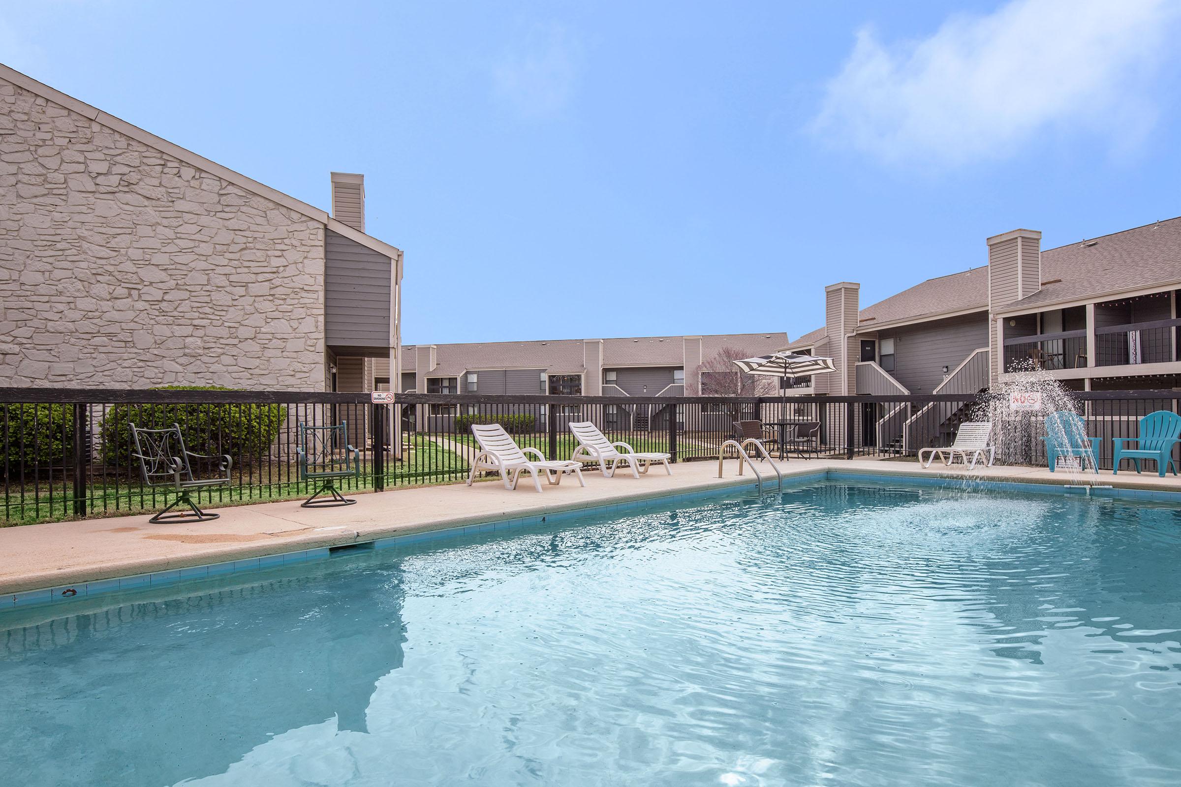 a house with a large pool of water