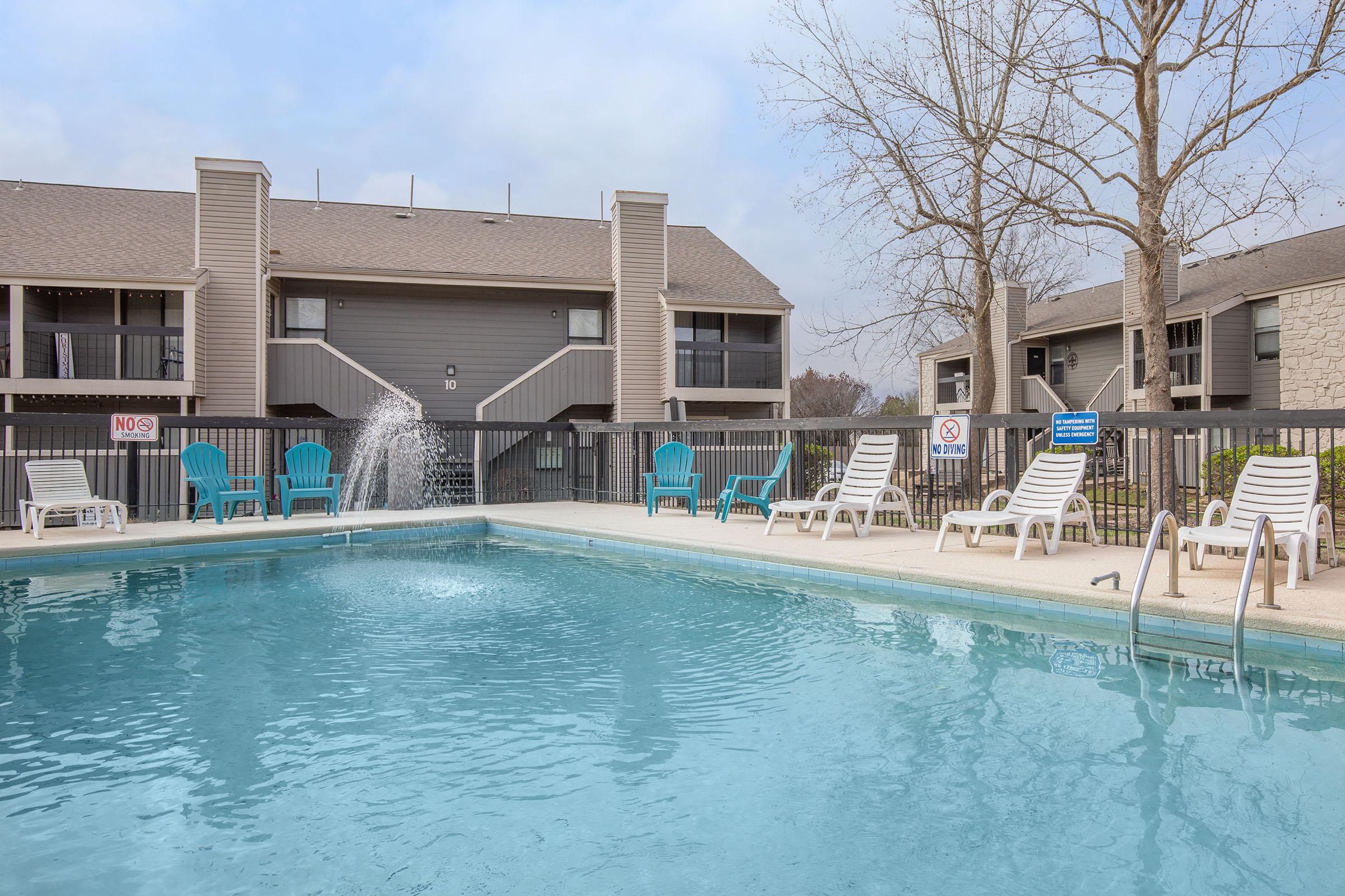 a large pool of water in front of a building