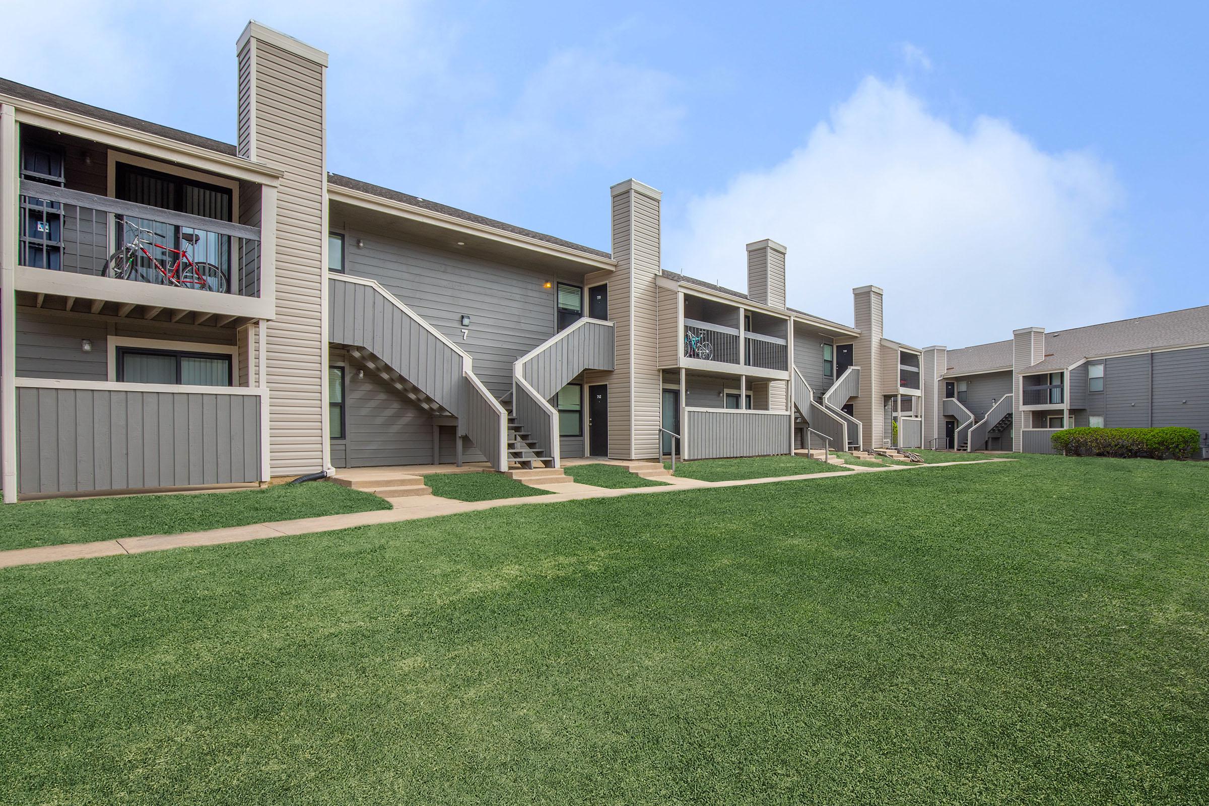 a large lawn in front of a building