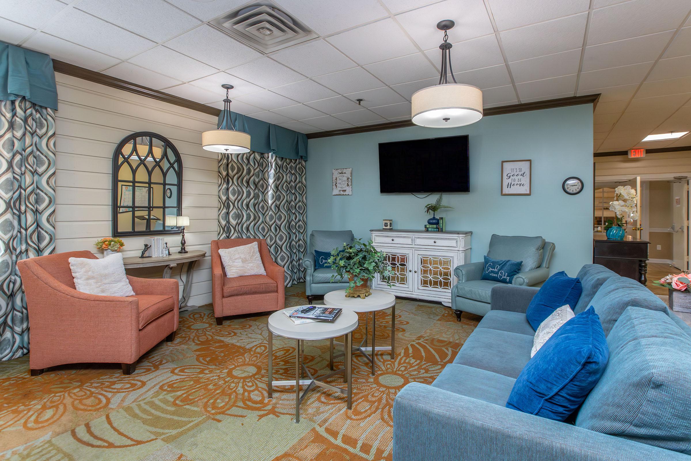 a living room filled with furniture and a fireplace