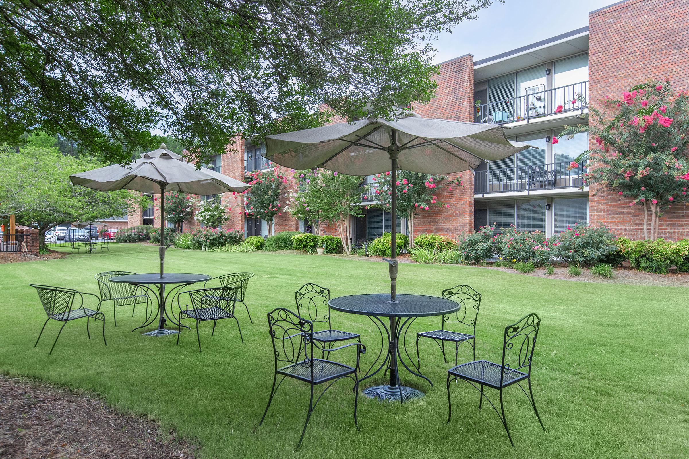 a group of lawn chairs sitting on top of a picnic table