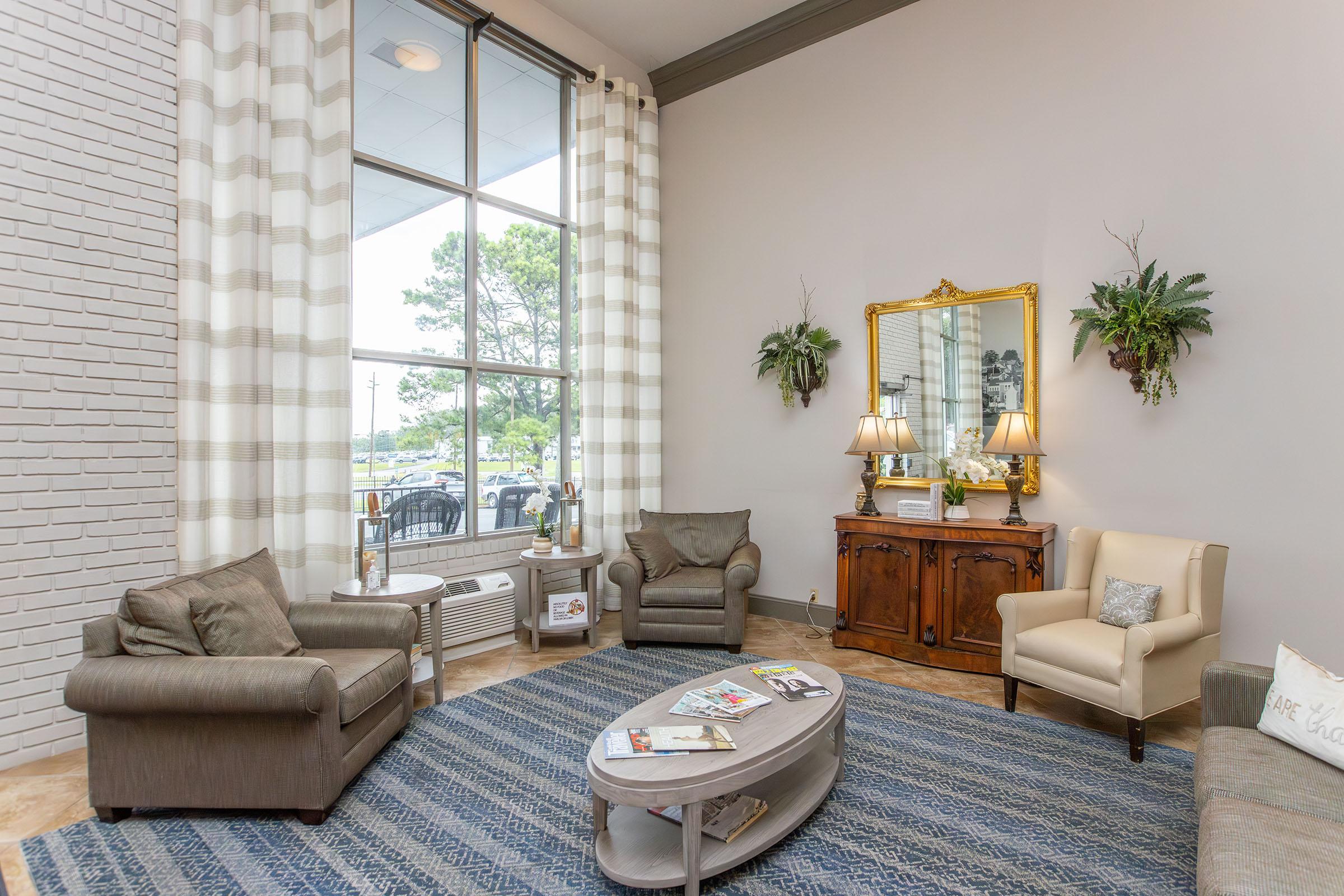 a living room filled with furniture and a fire place