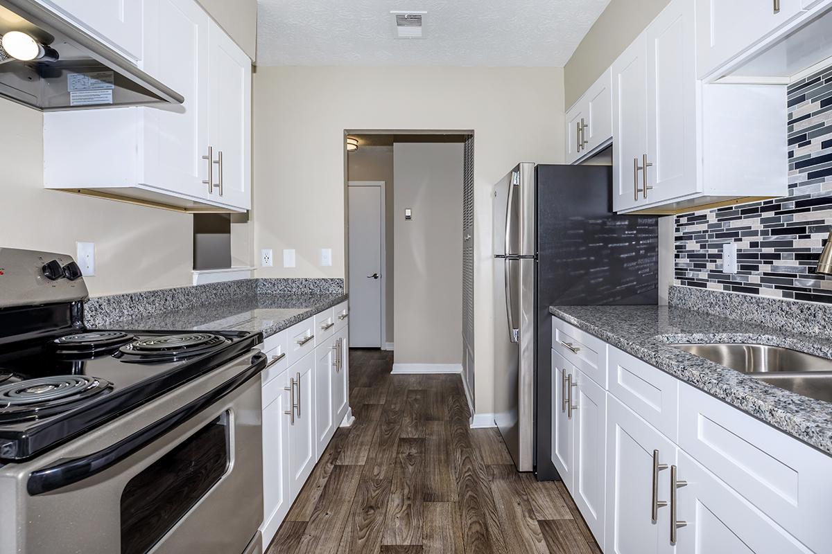 a kitchen with a stove top oven