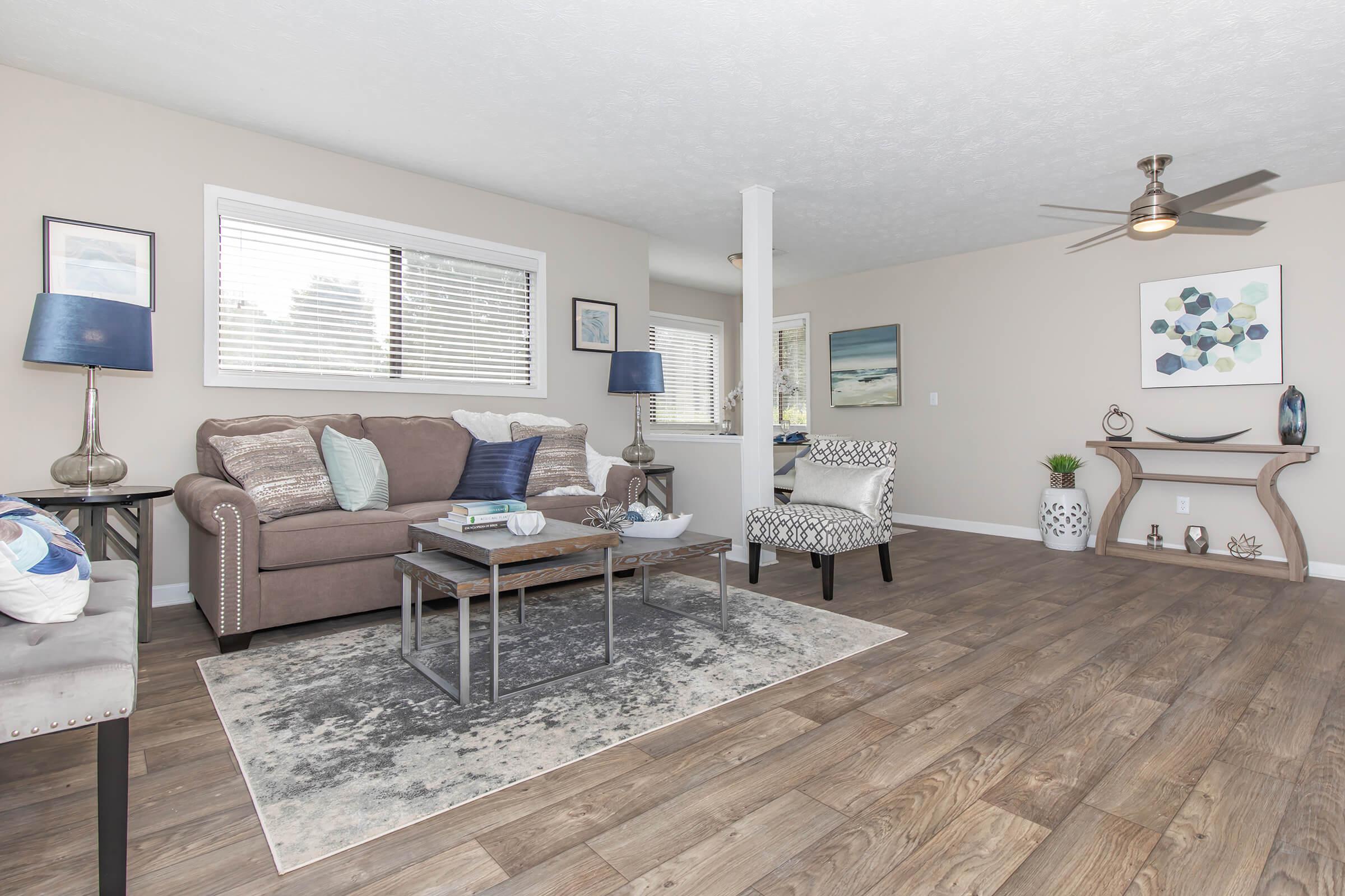 a living room filled with furniture and a tv