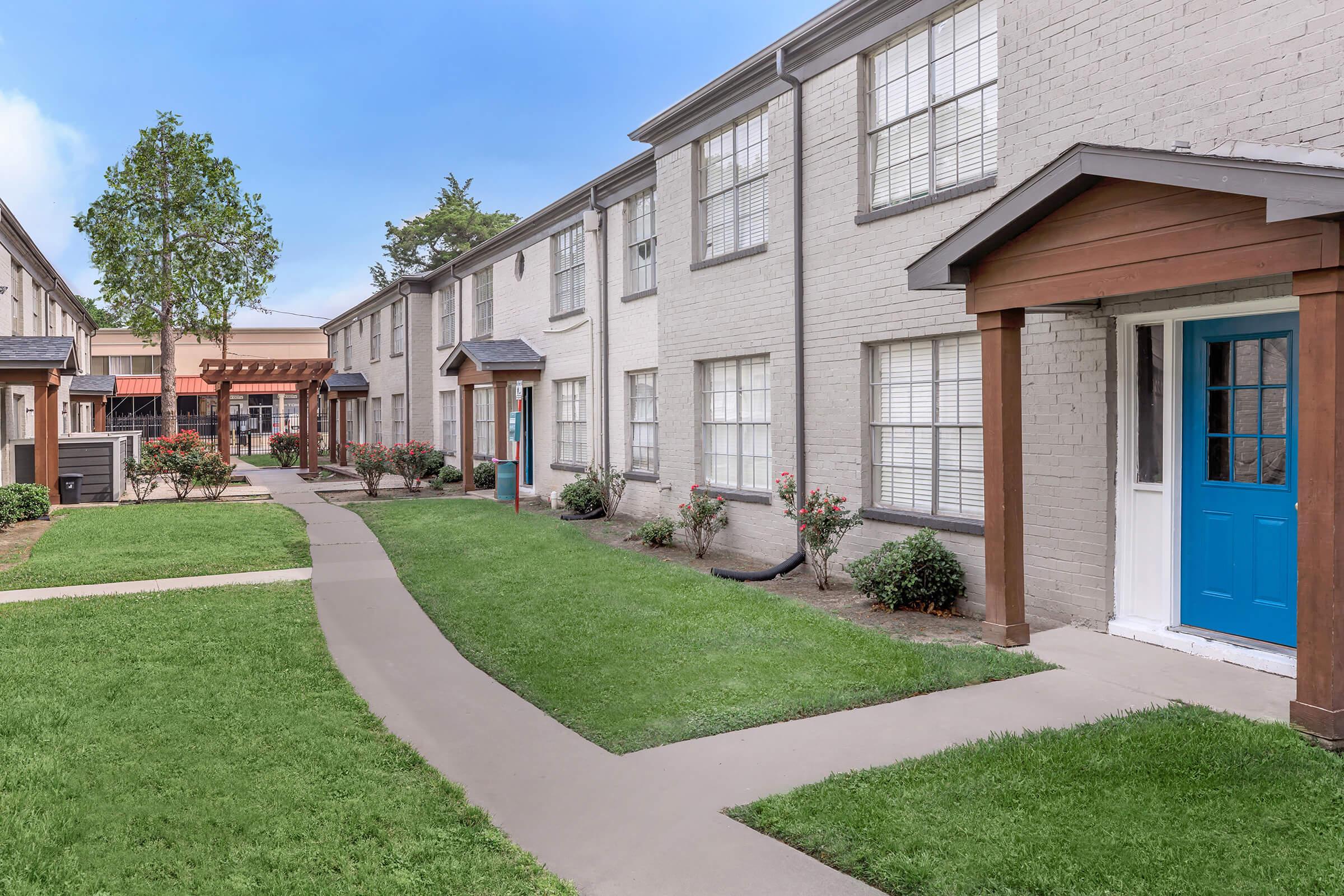 a large lawn in front of a house