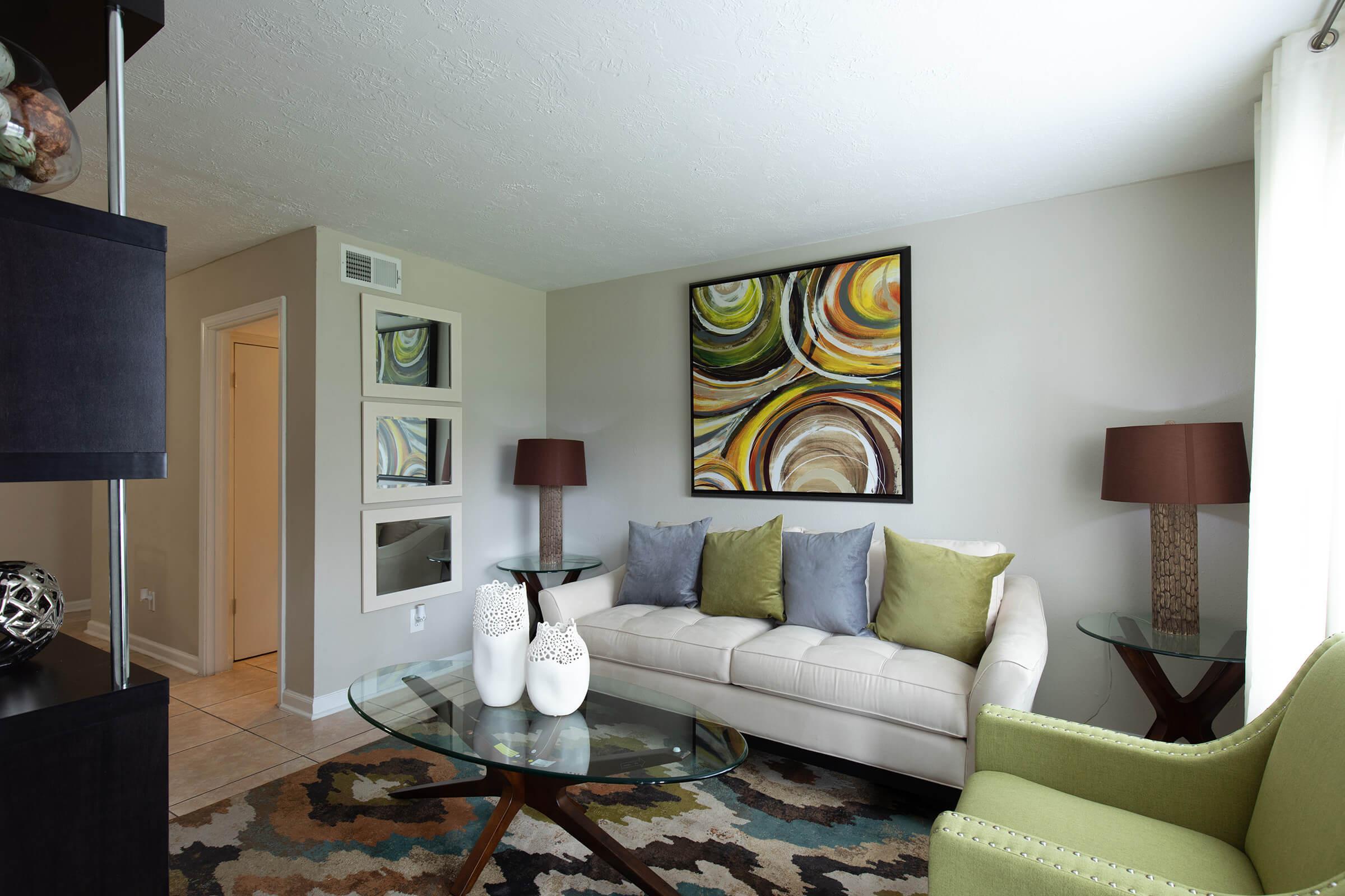 a living room filled with furniture and a fire place