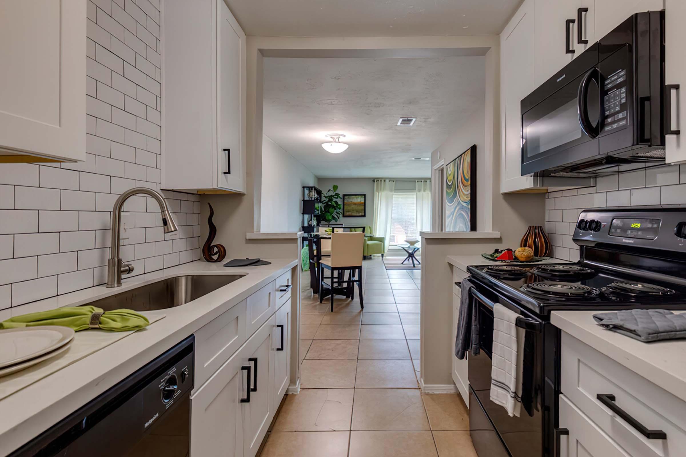 a kitchen with a stove top oven