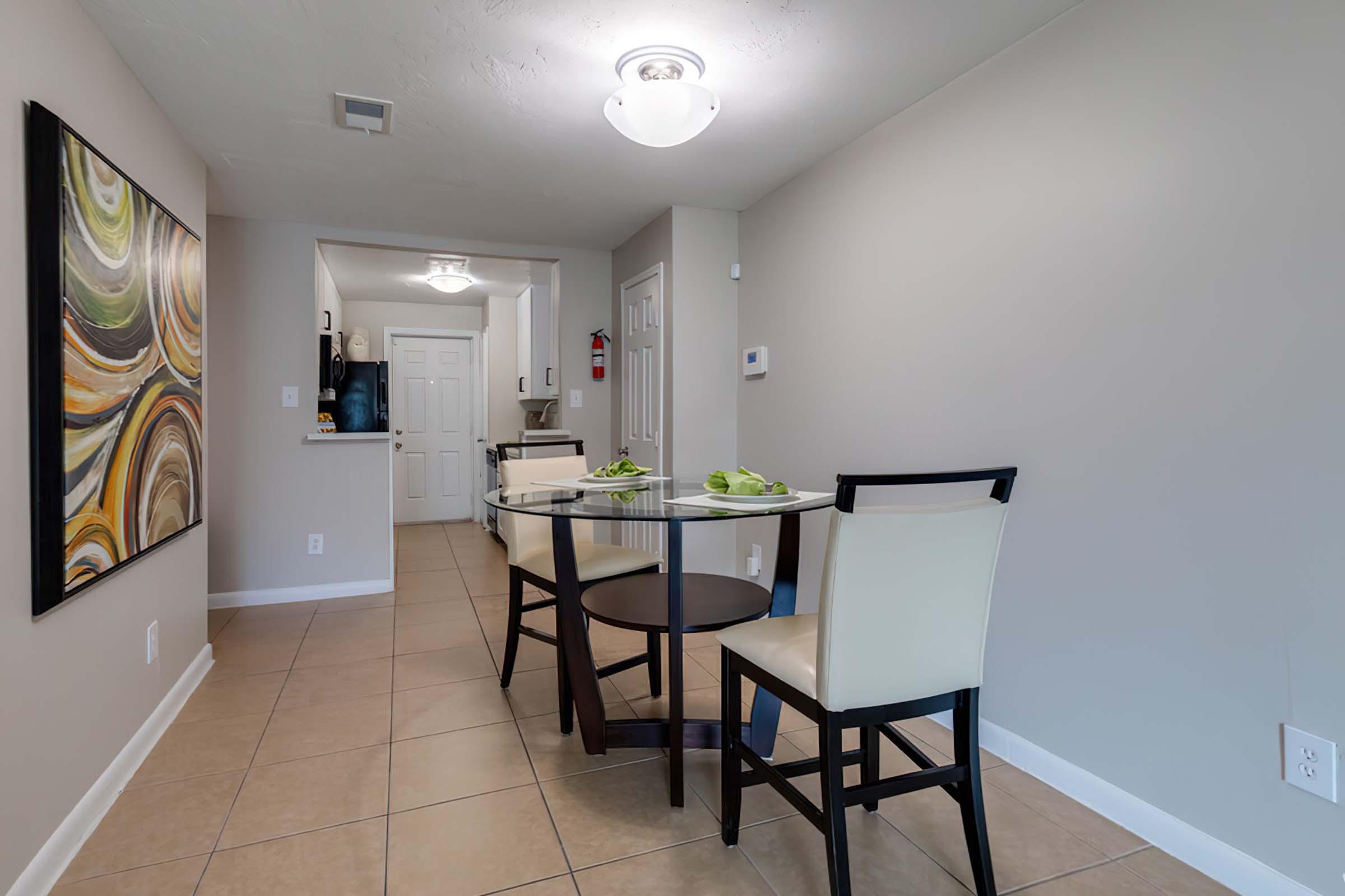 a kitchen with a table in a room