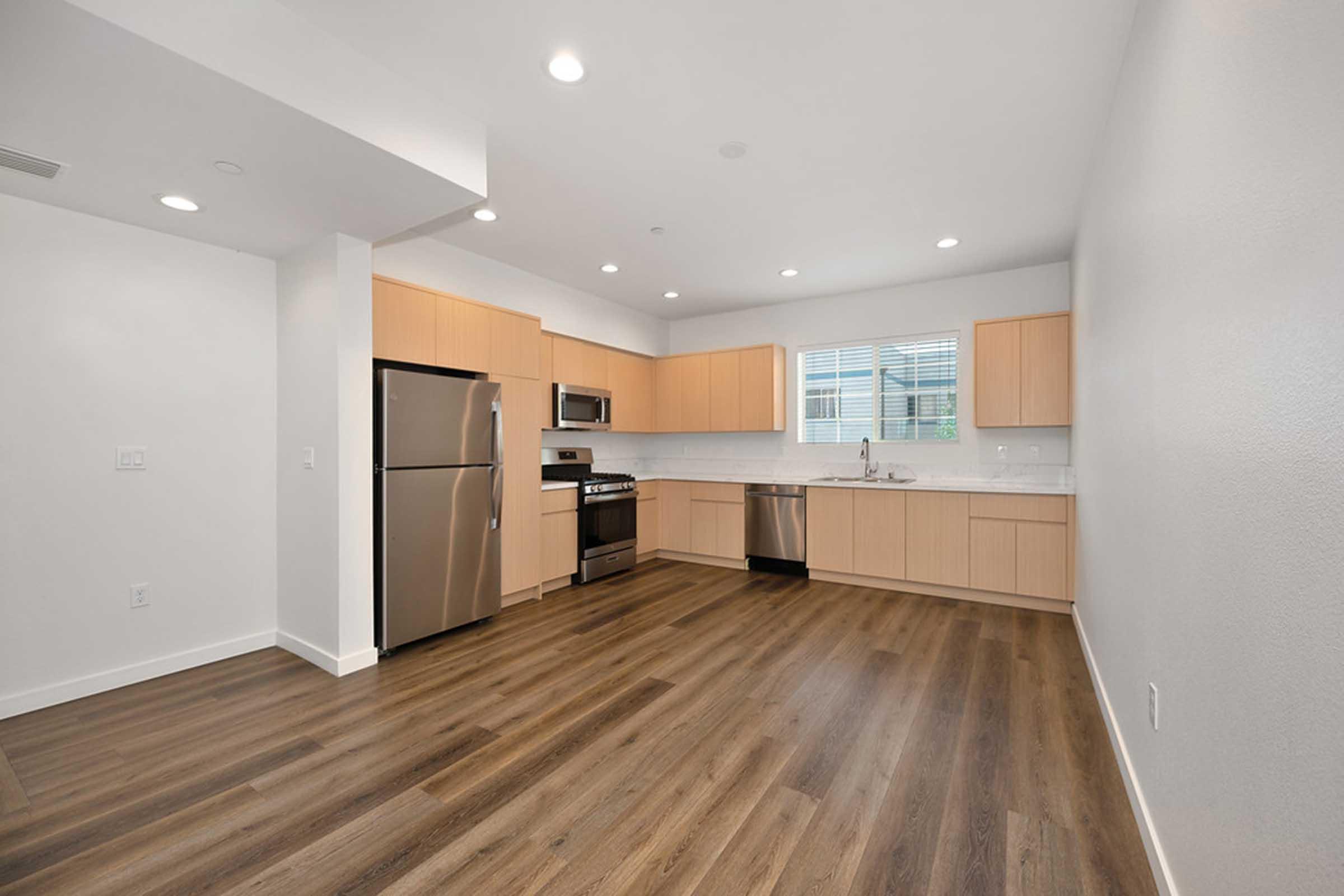 a kitchen with a wood floor