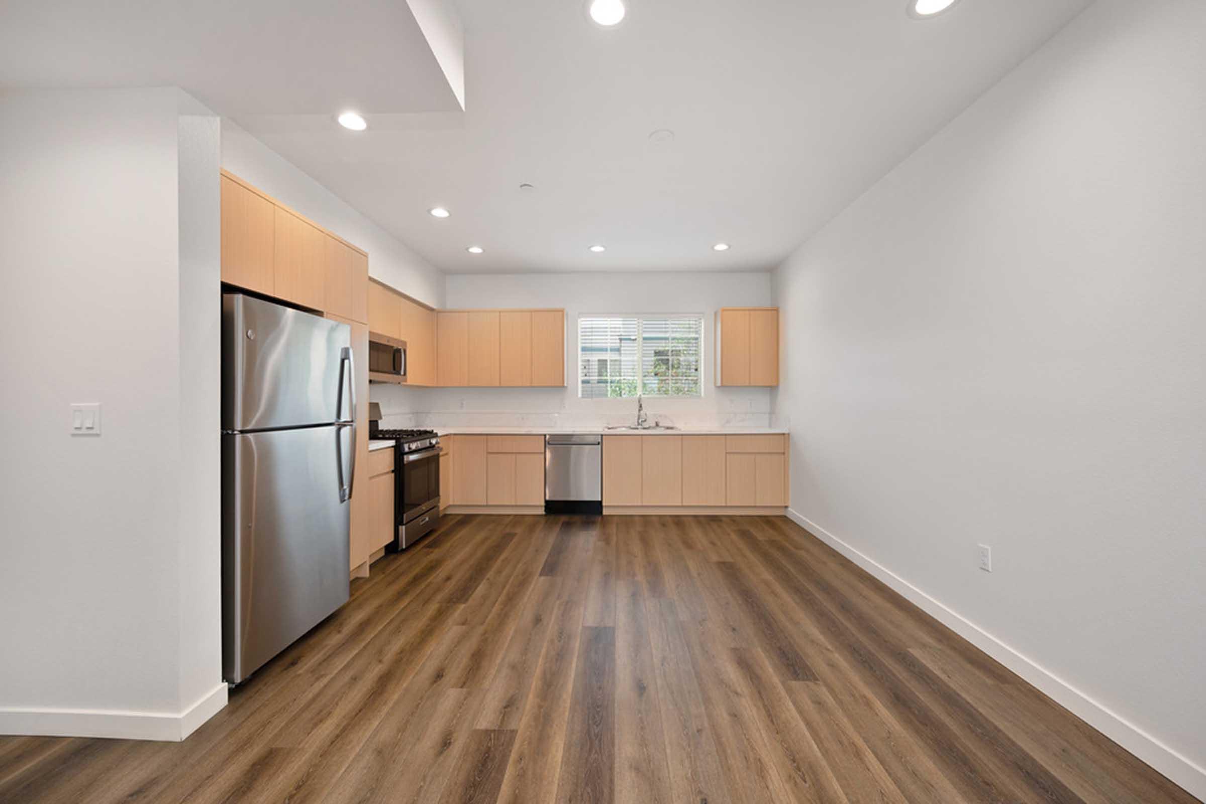 a kitchen with wood cabinets