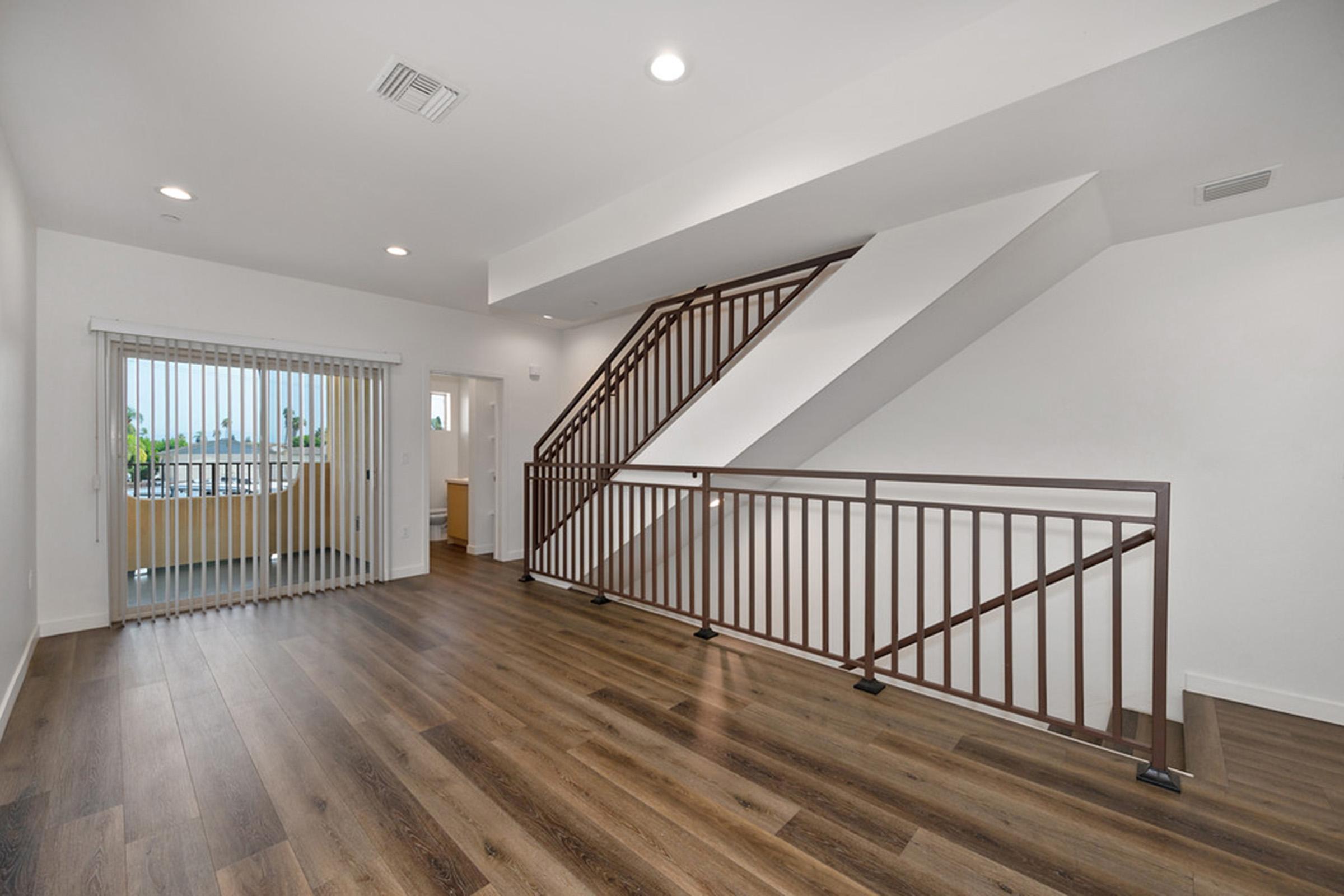 a large room with a staircase