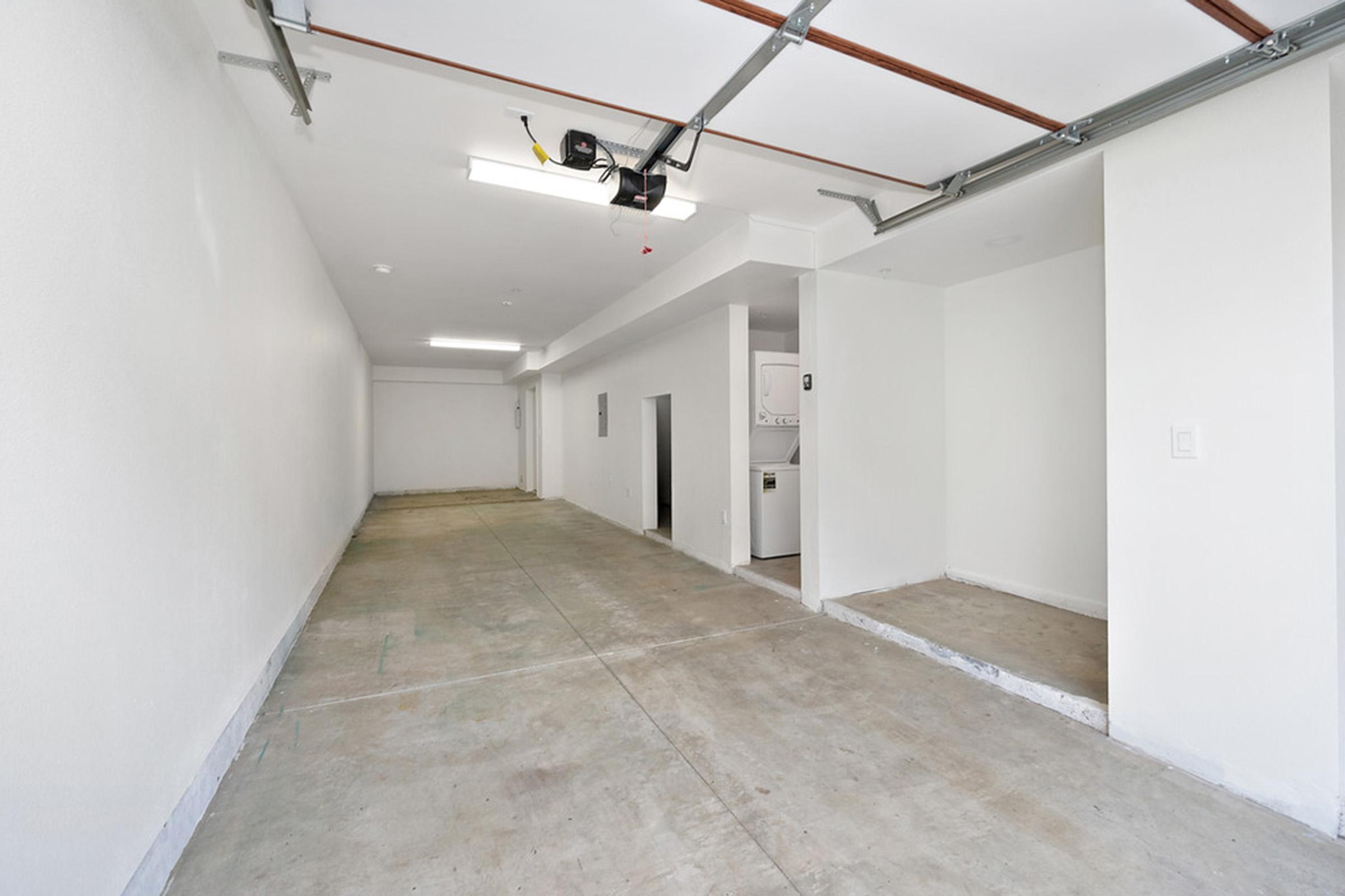 an empty garage with laundry