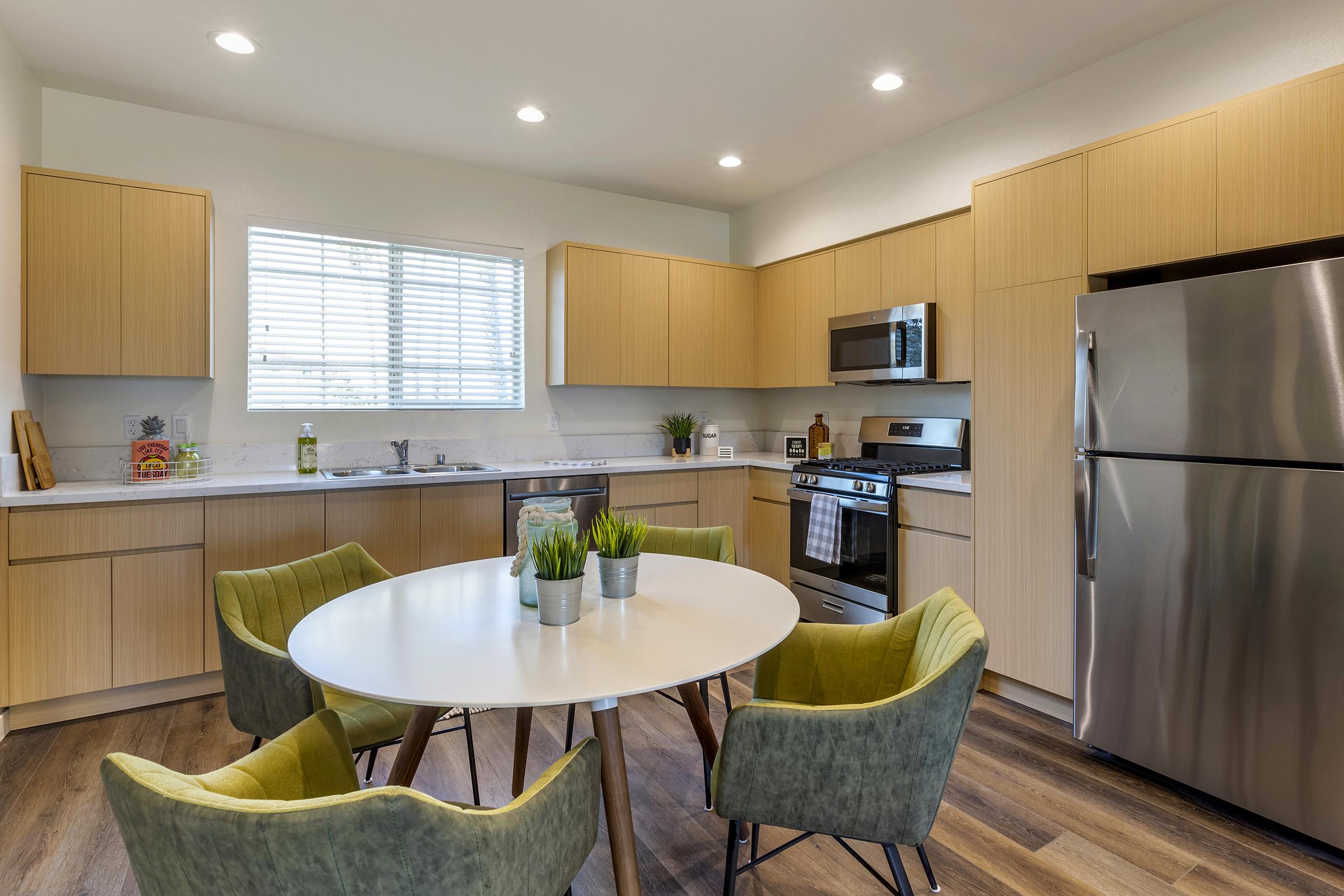 a kitchen with a dining room table