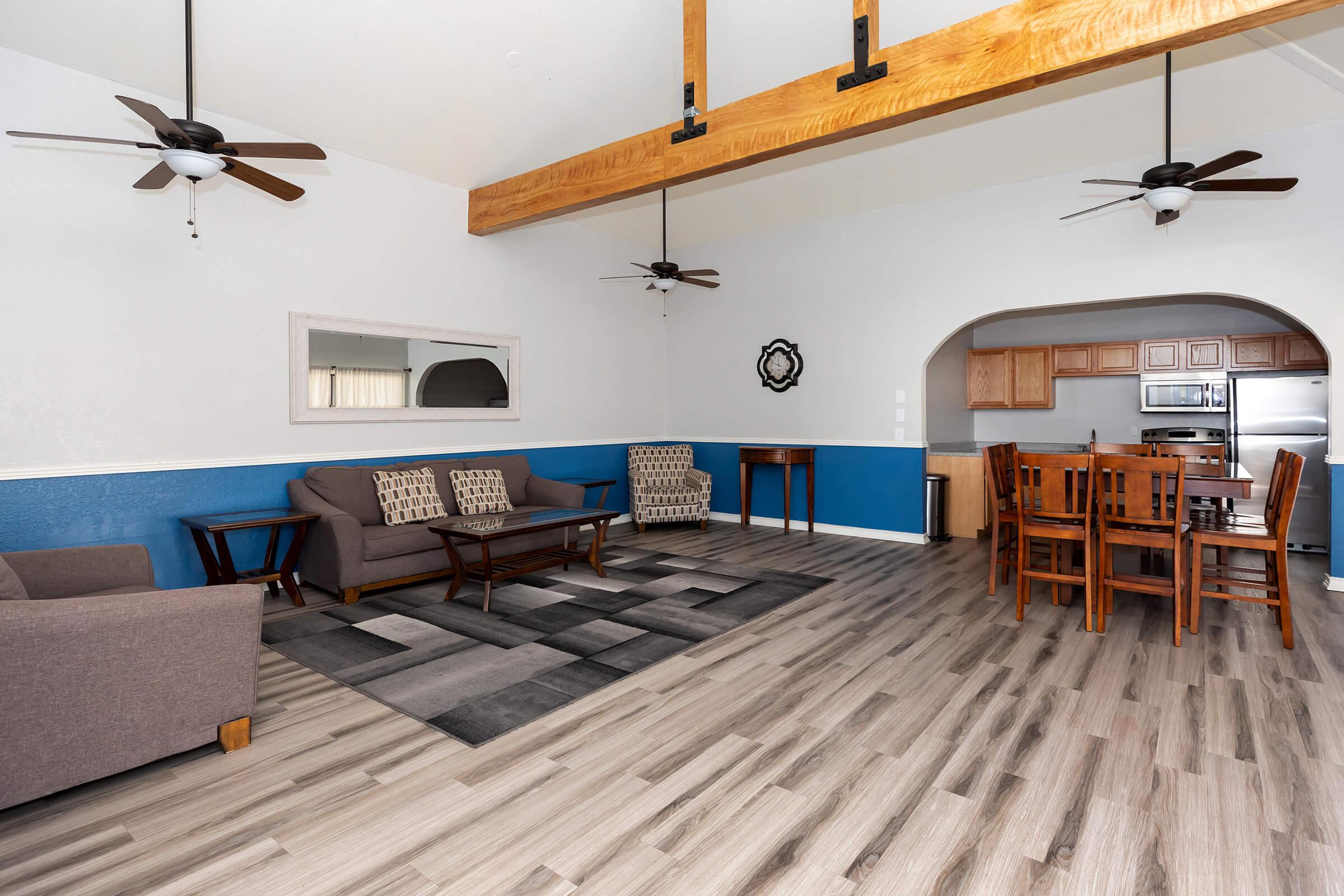 a living area with wooden wheels in a room