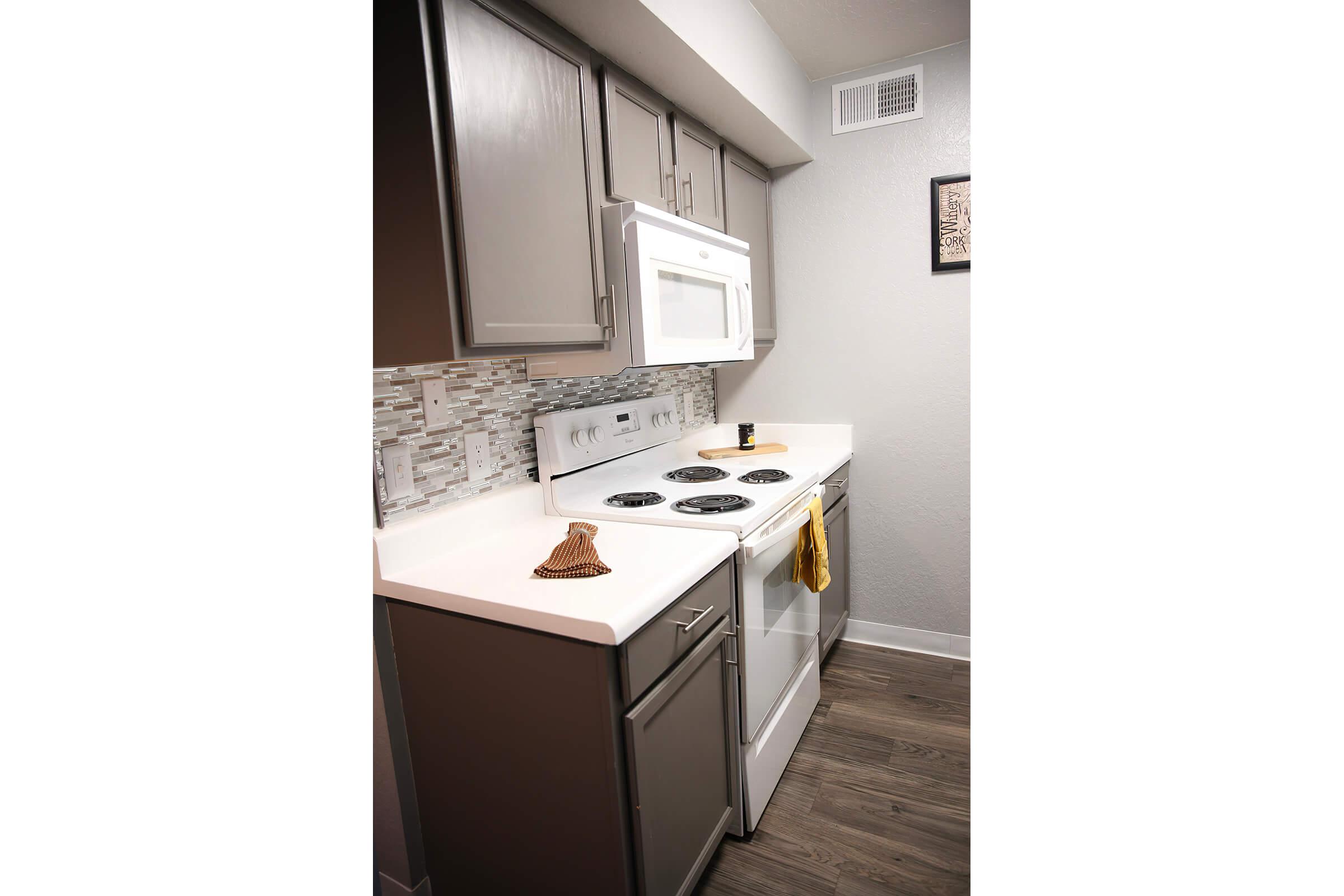 a kitchen with a stove and a refrigerator