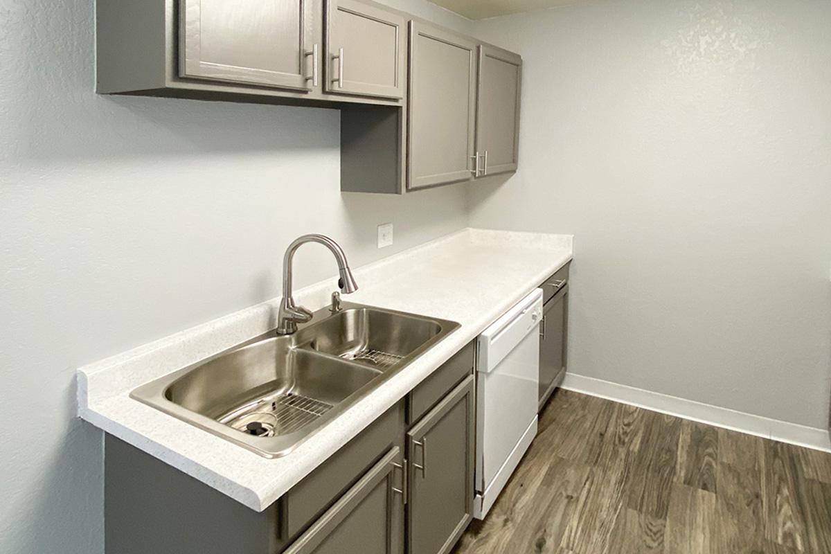 a kitchen with a sink and a microwave