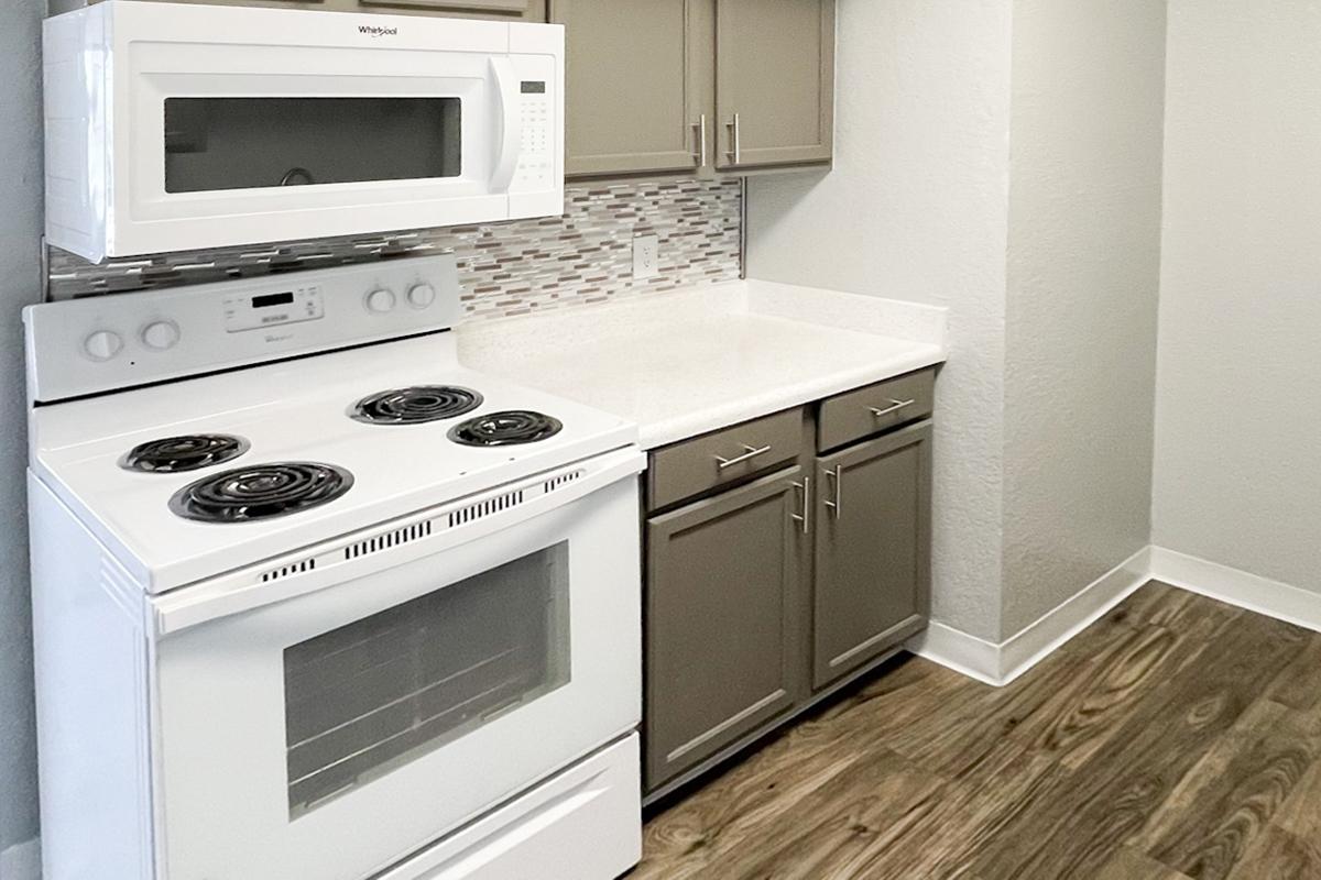 a microwave oven sitting on top of a stove