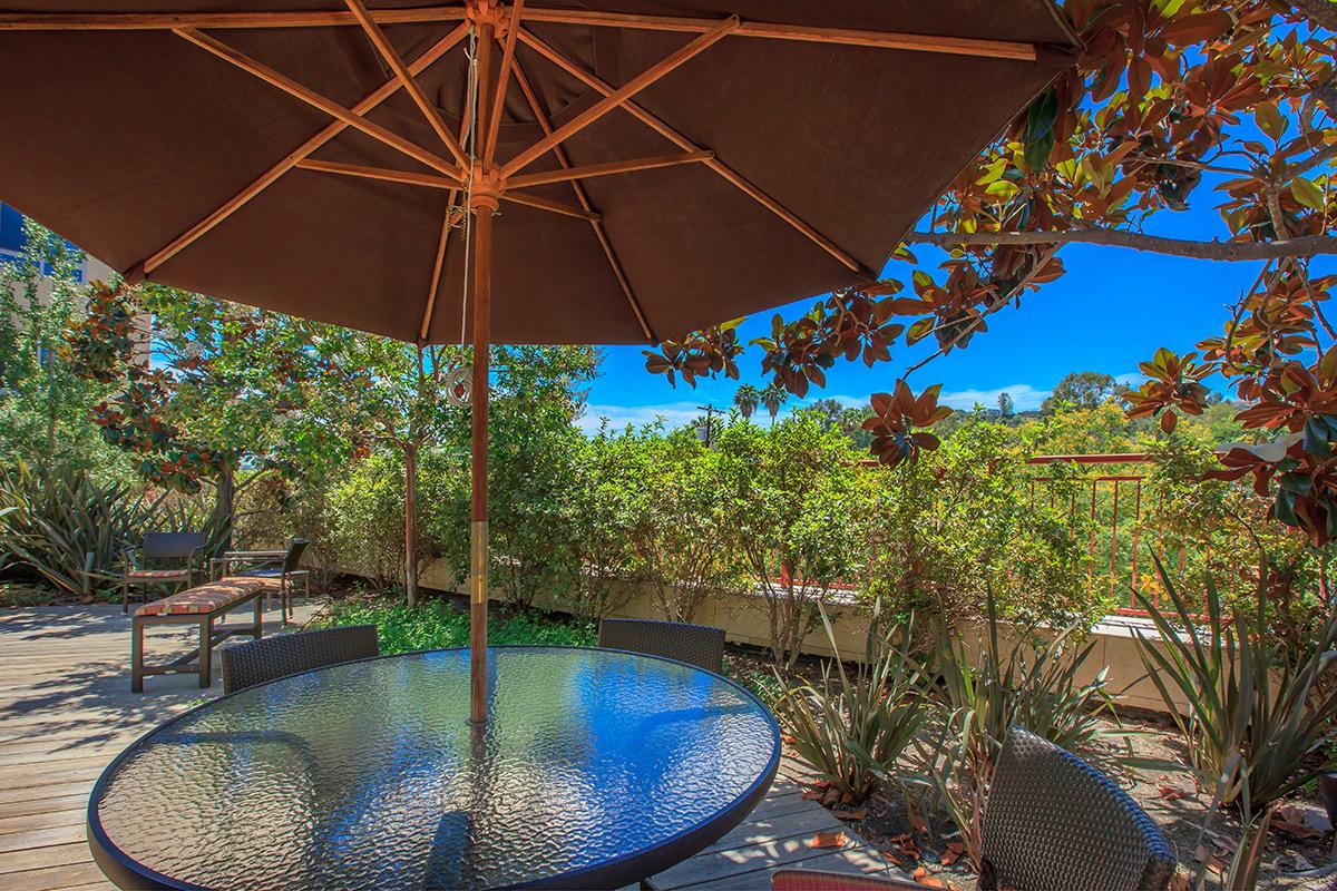 a table topped with a blue umbrella