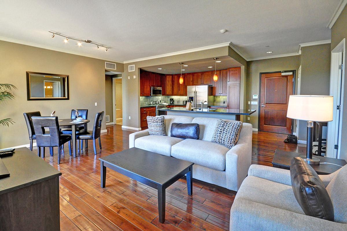 a living room filled with furniture and a large window