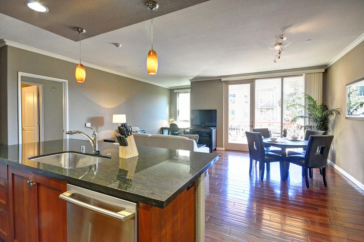 a kitchen with an island in the middle of a room