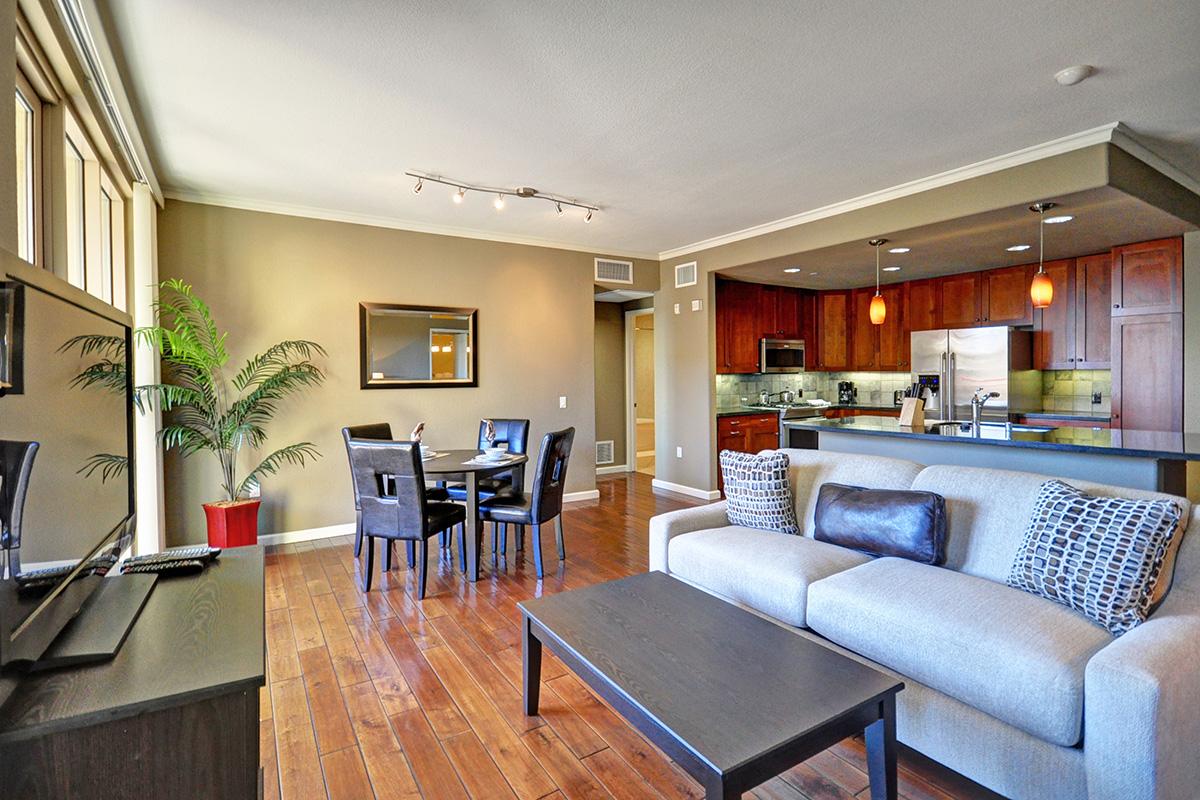 a living room filled with furniture and a large window