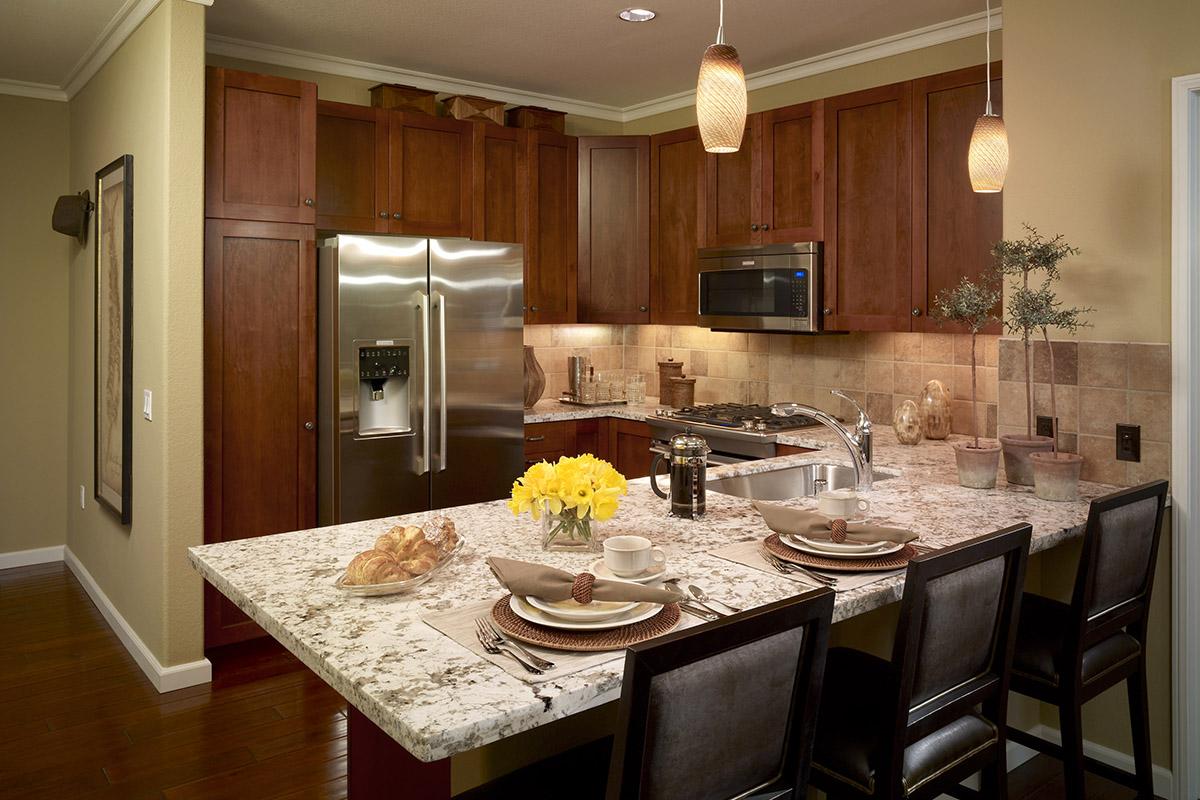 a modern kitchen with stainless steel appliances