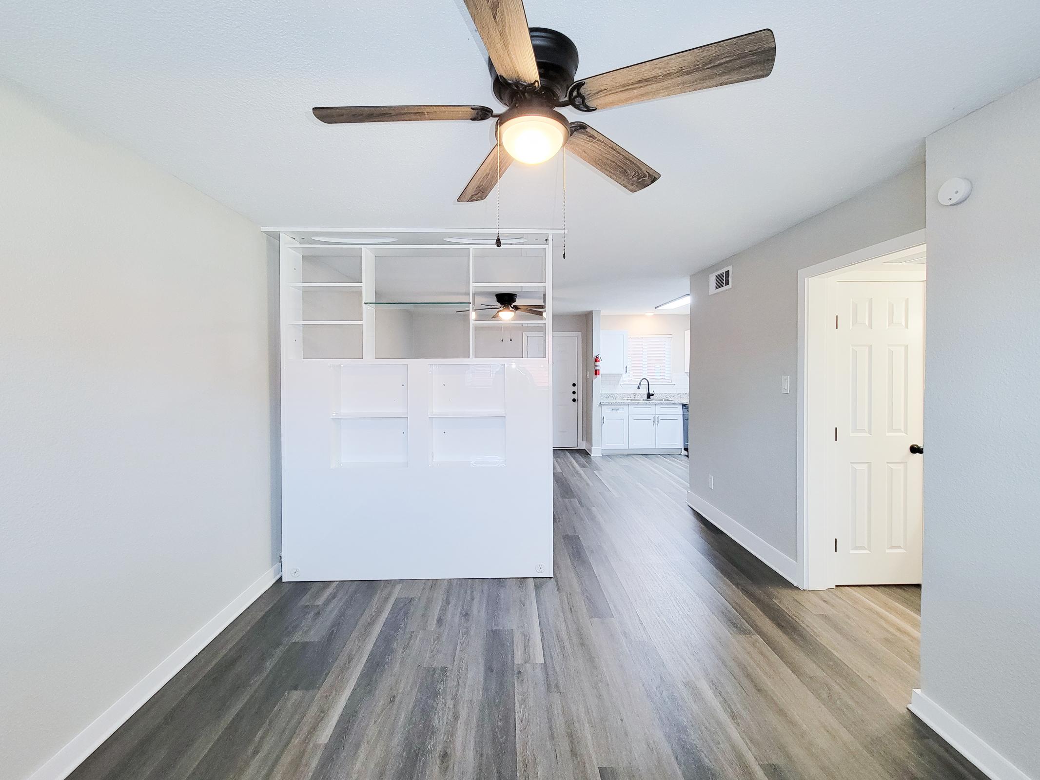 a kitchen with a wooden floor