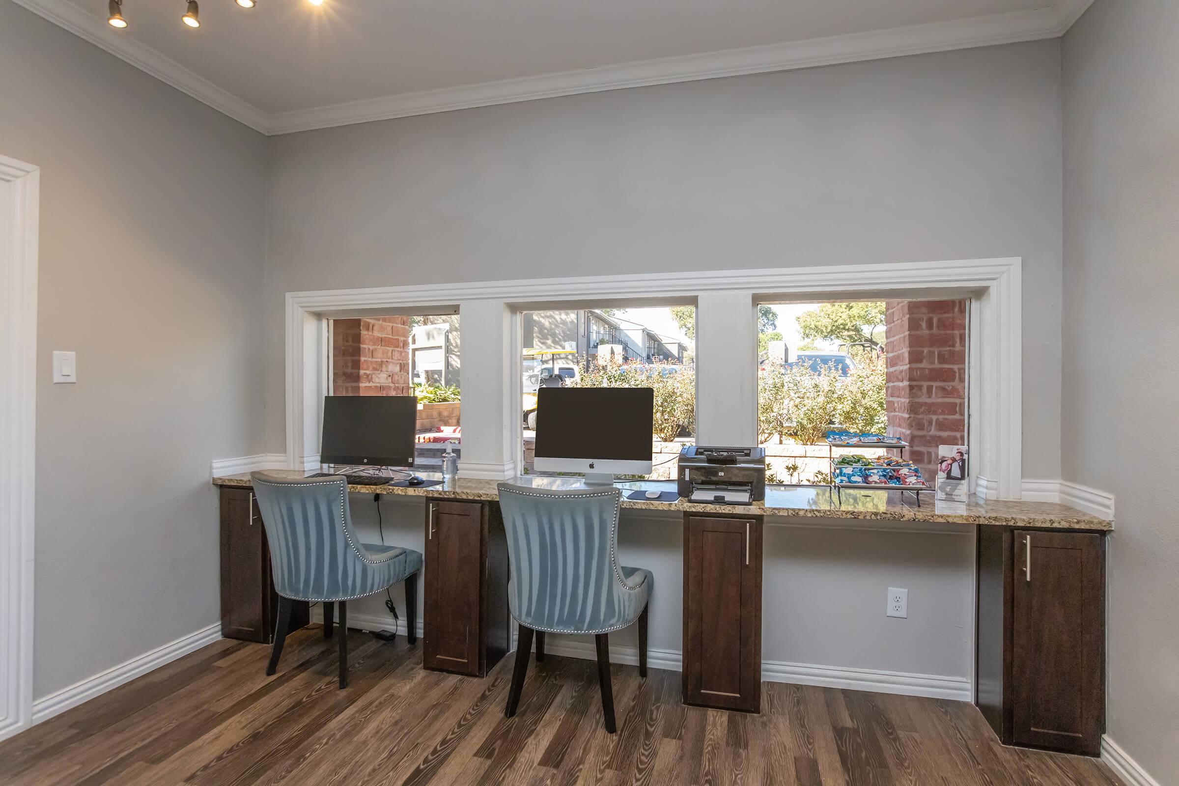 a room filled with furniture and a large window