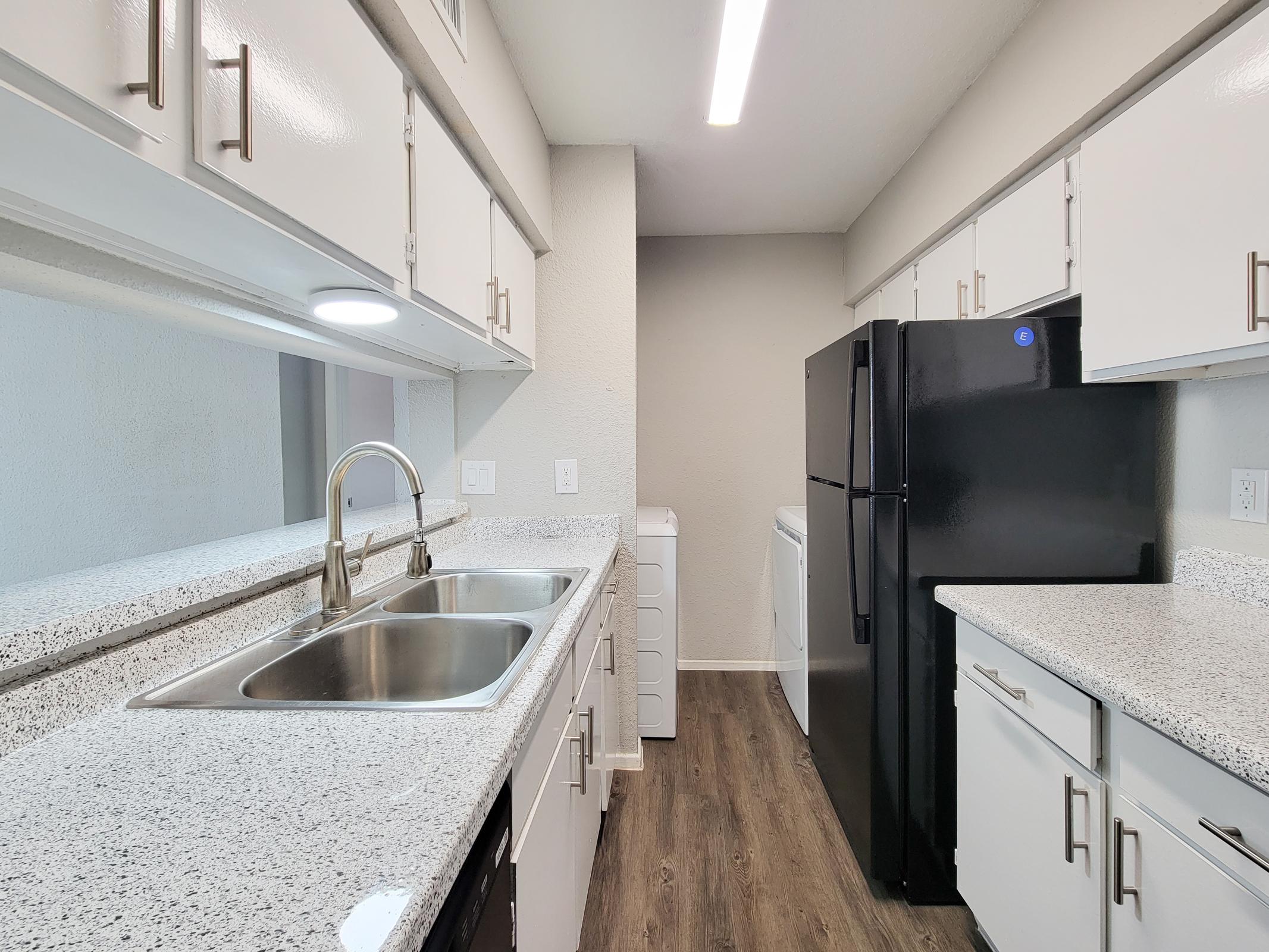 a large kitchen with stainless steel appliances