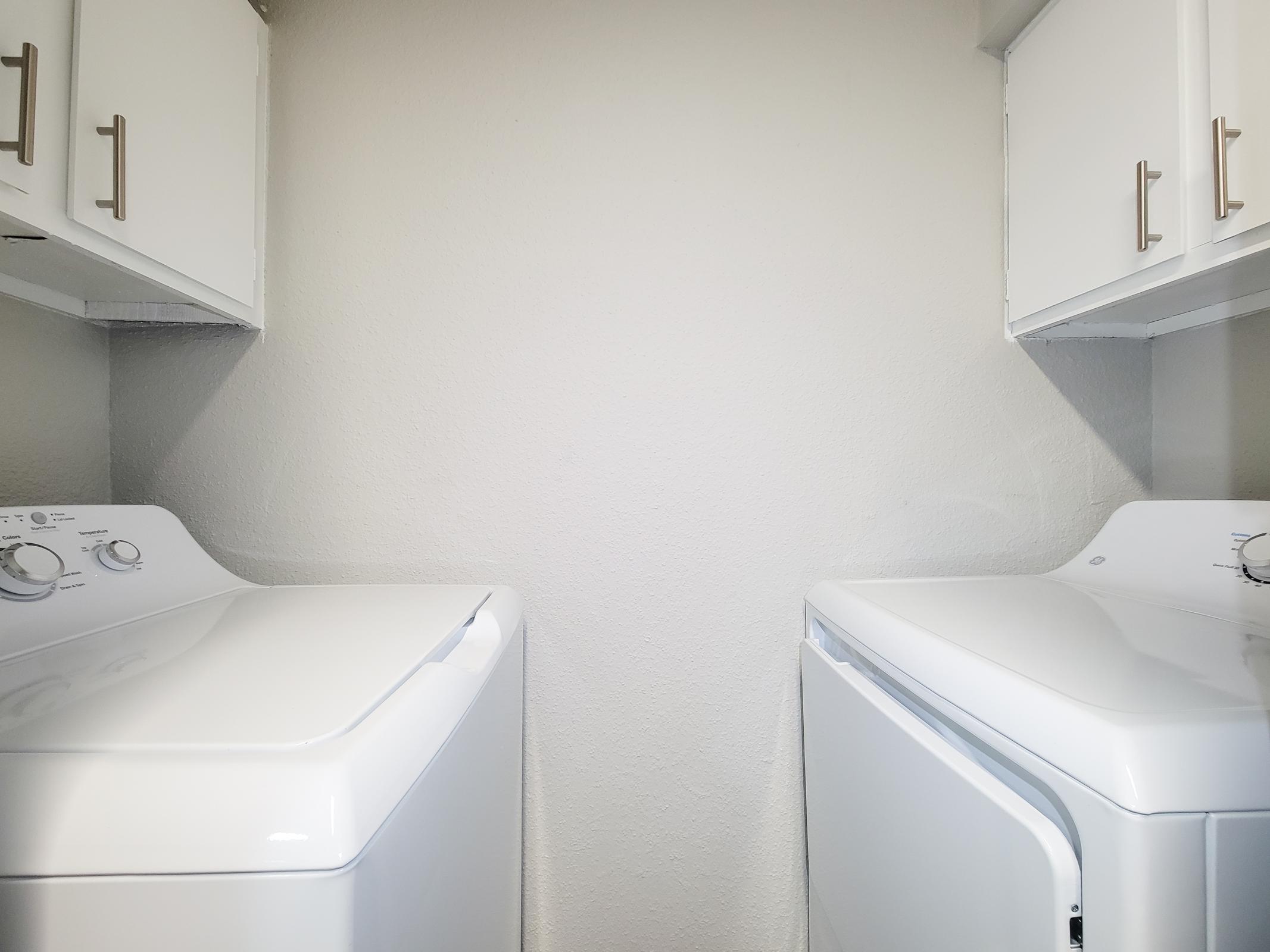 a kitchen with a sink and a microwave