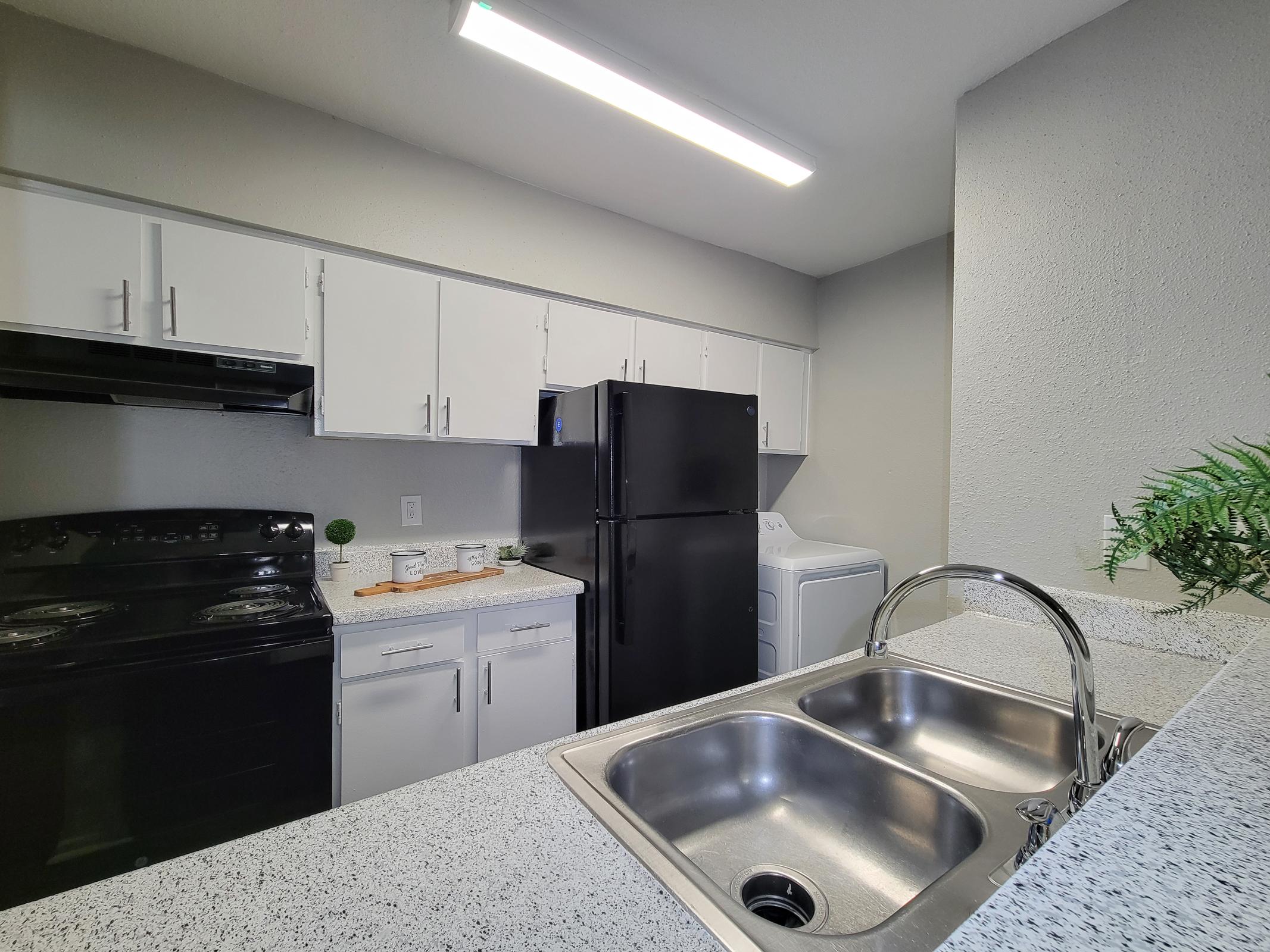 a kitchen with stainless steel appliances