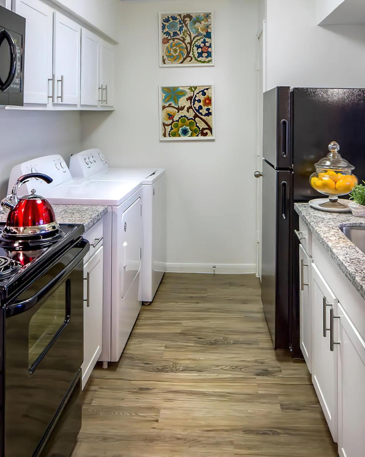 a kitchen with a stove top oven sitting inside of a building