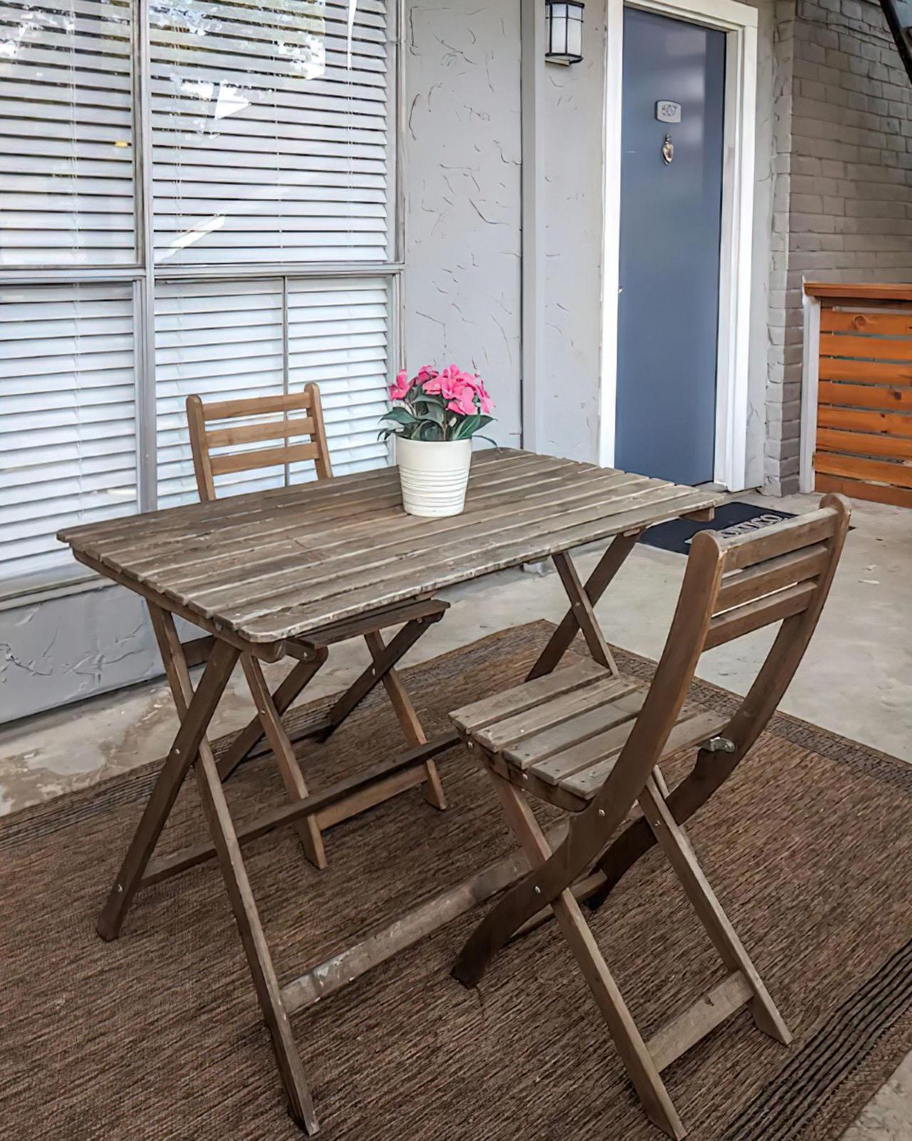 a dining room table in front of a wooden chair