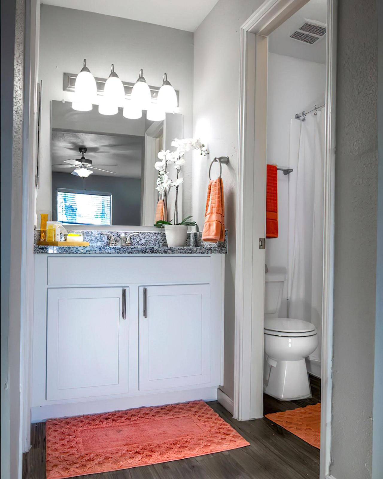 a double door refrigerator in the corner of a room