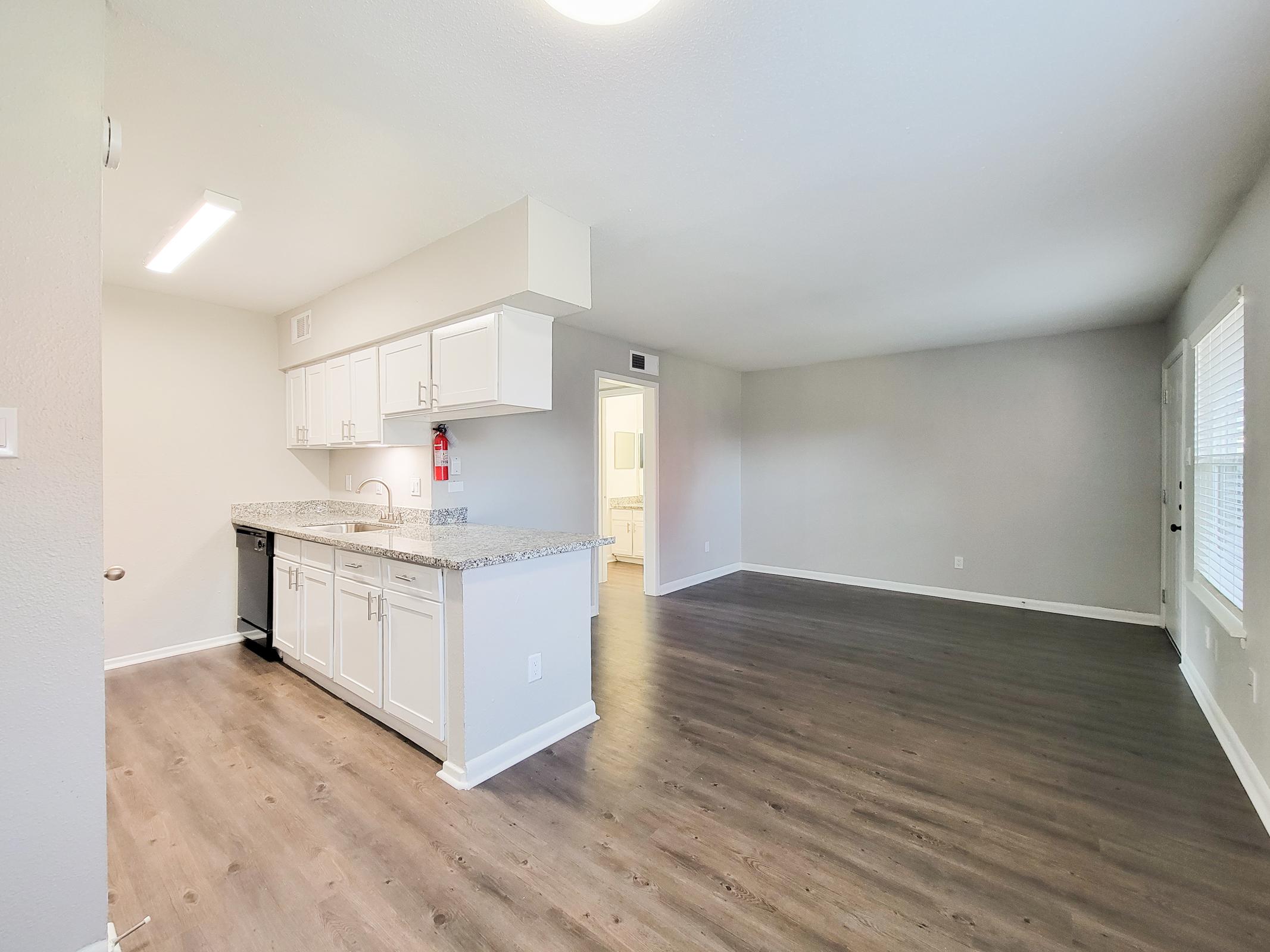 a kitchen with a wooden floor