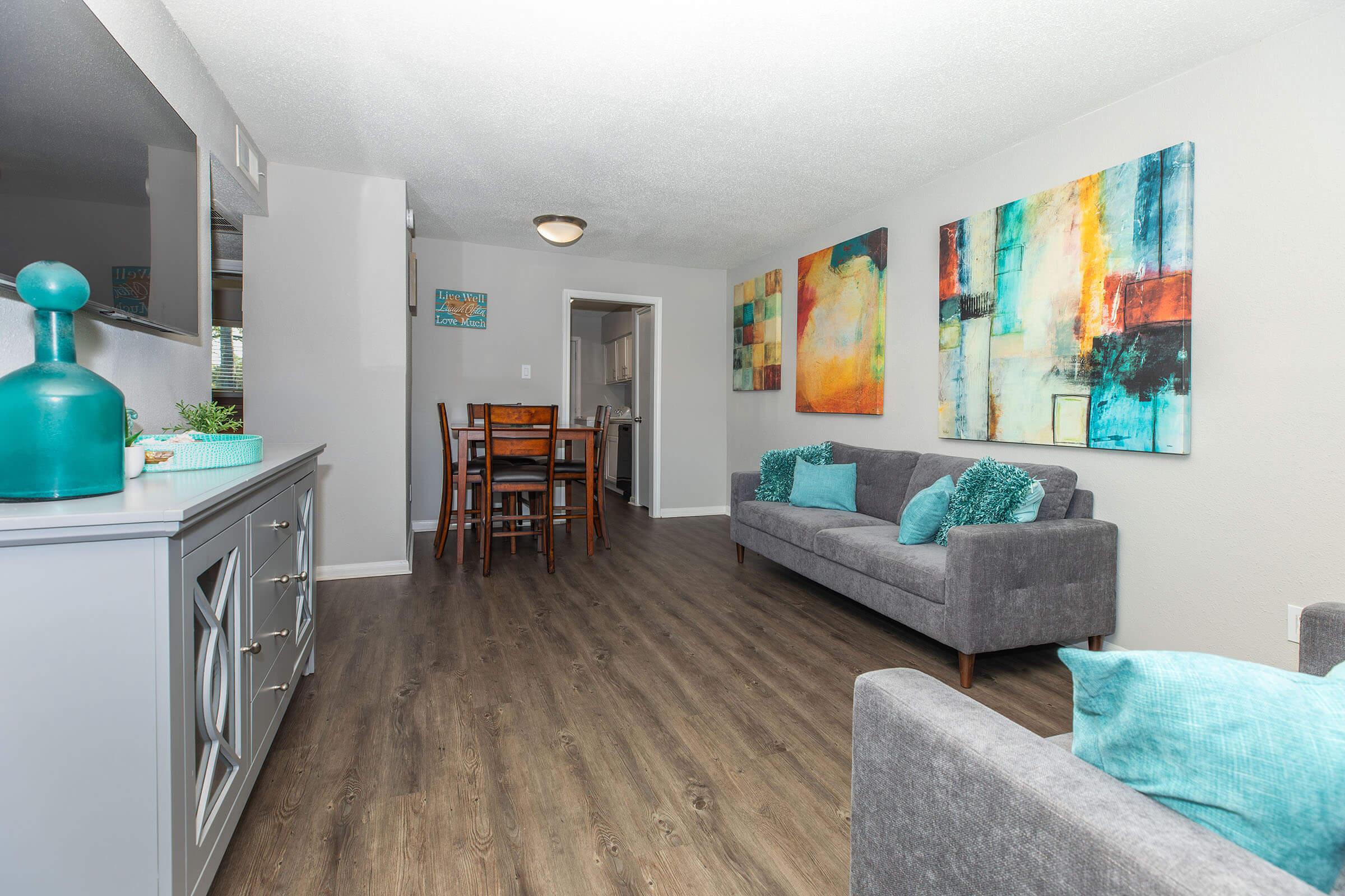 a living room filled with furniture and a tv