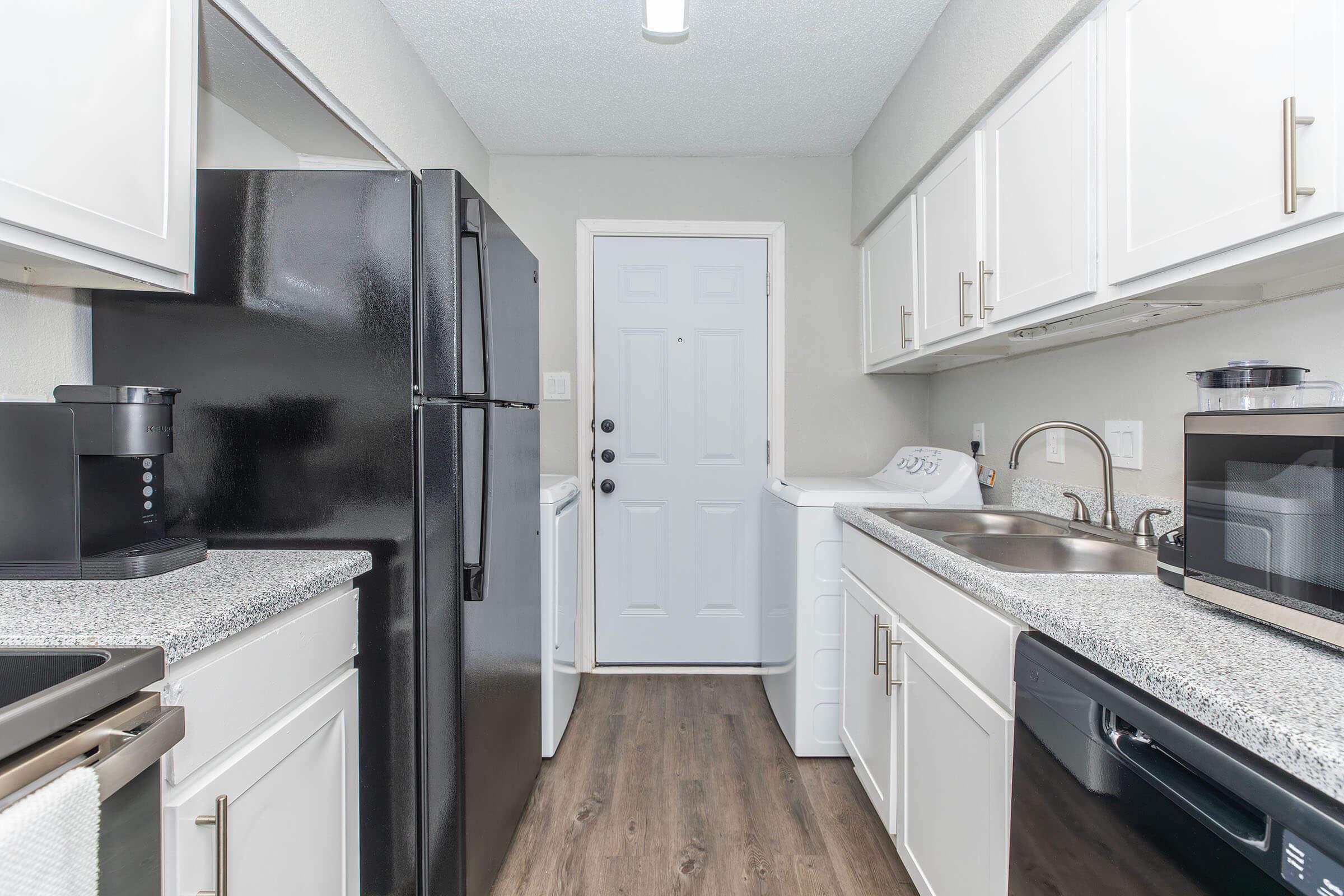 a kitchen with a stove and a sink