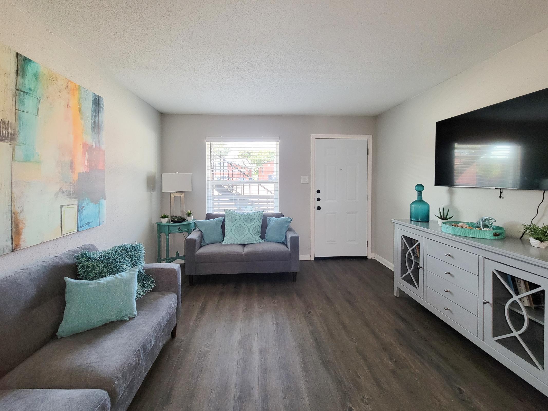 a living room filled with lots of furniture