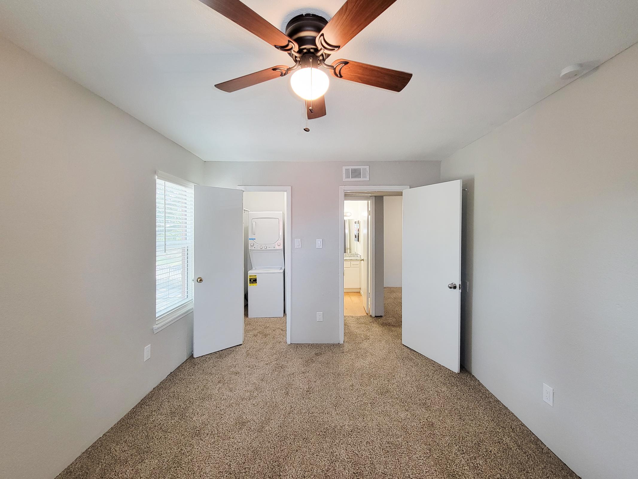 a bedroom with a large mirror