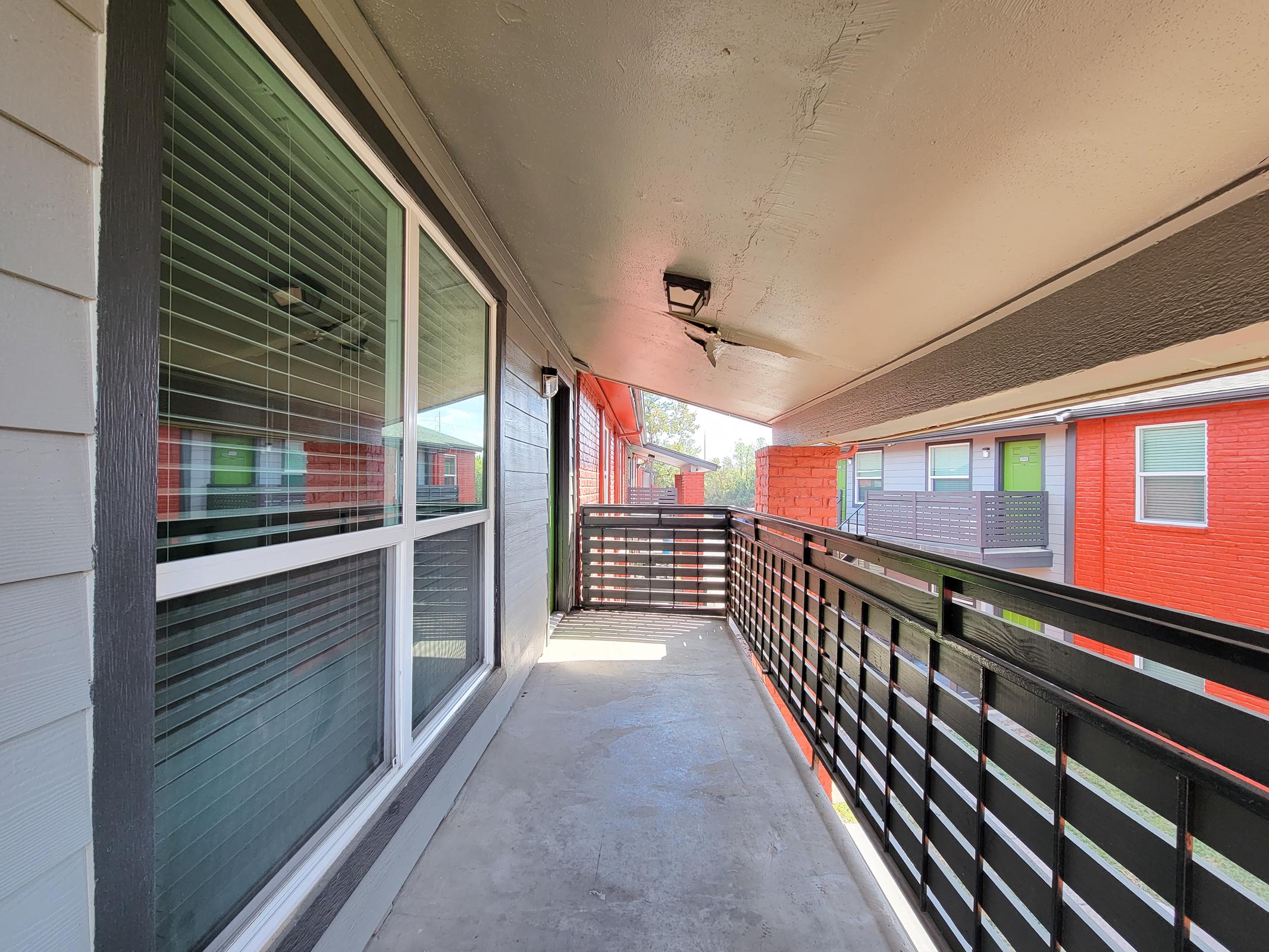 a train is parked on the side of a building