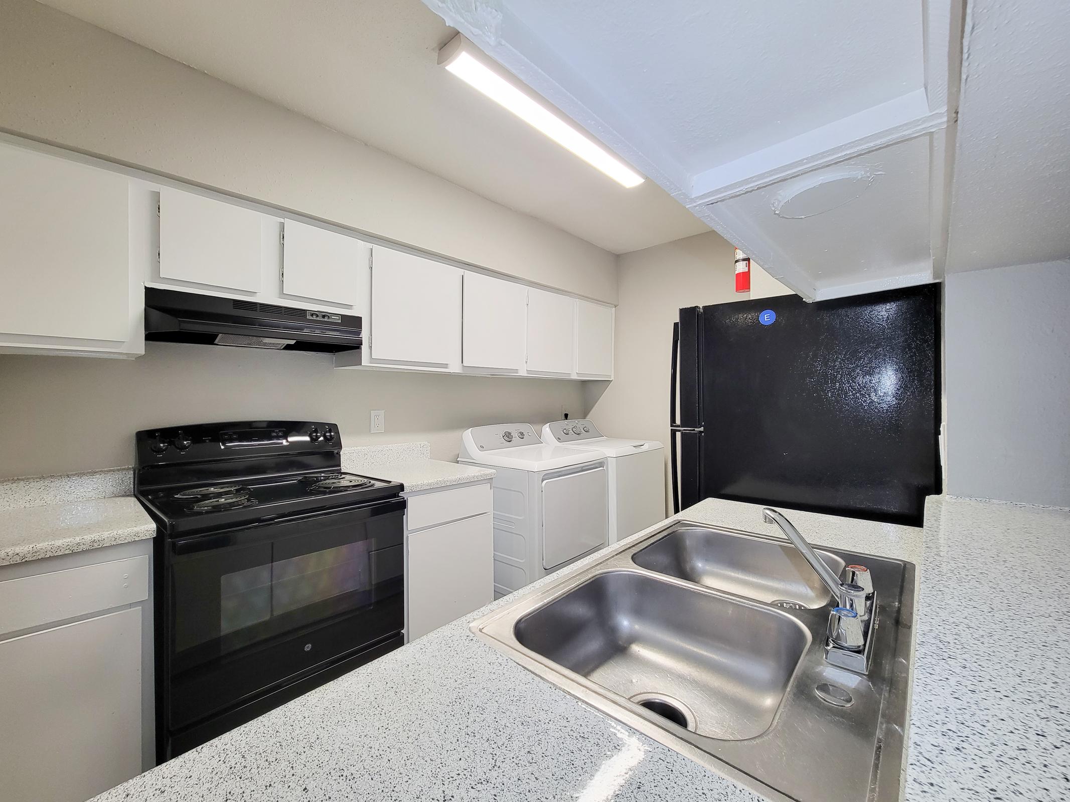 a kitchen with stainless steel appliances