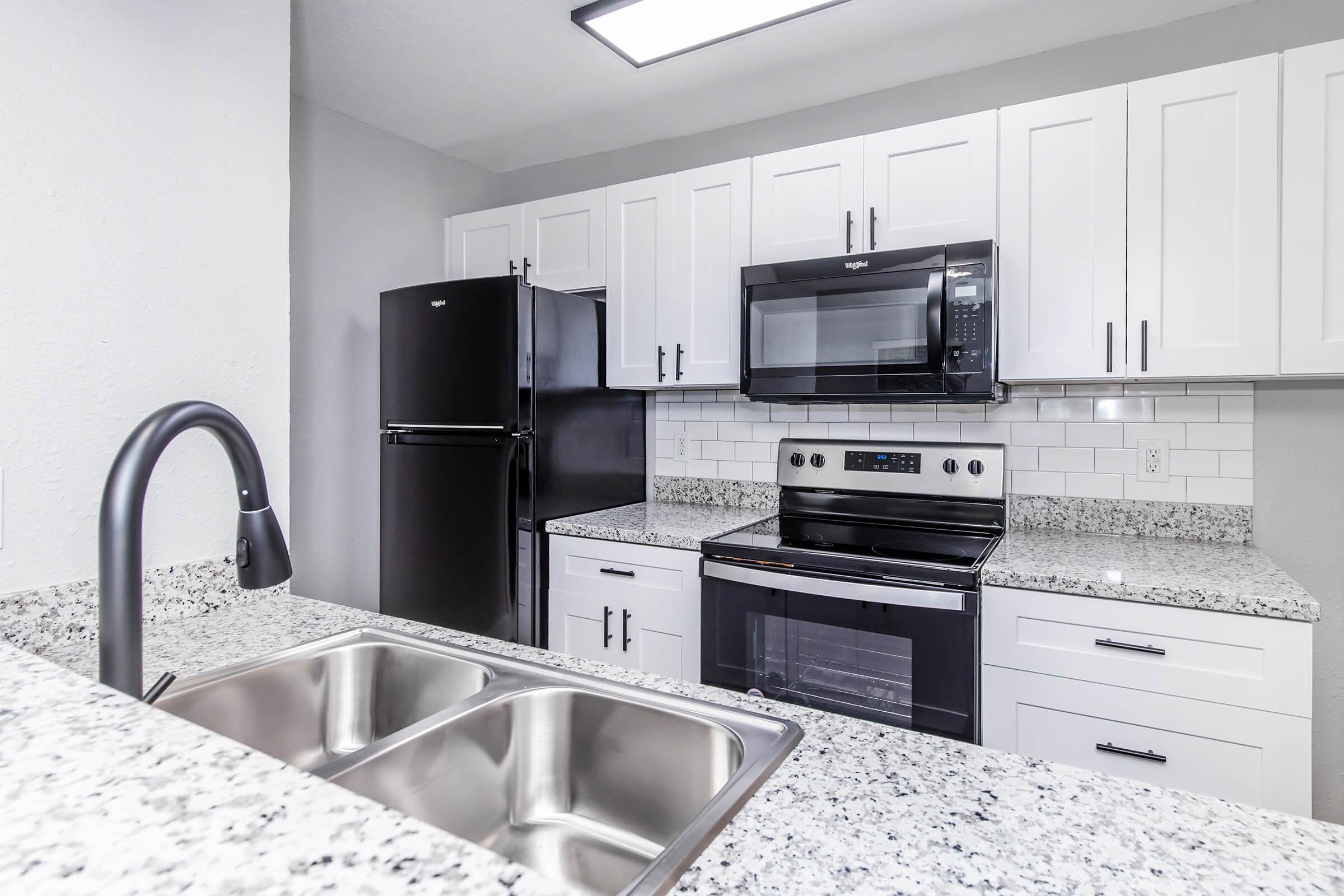 a kitchen with stainless steel appliances