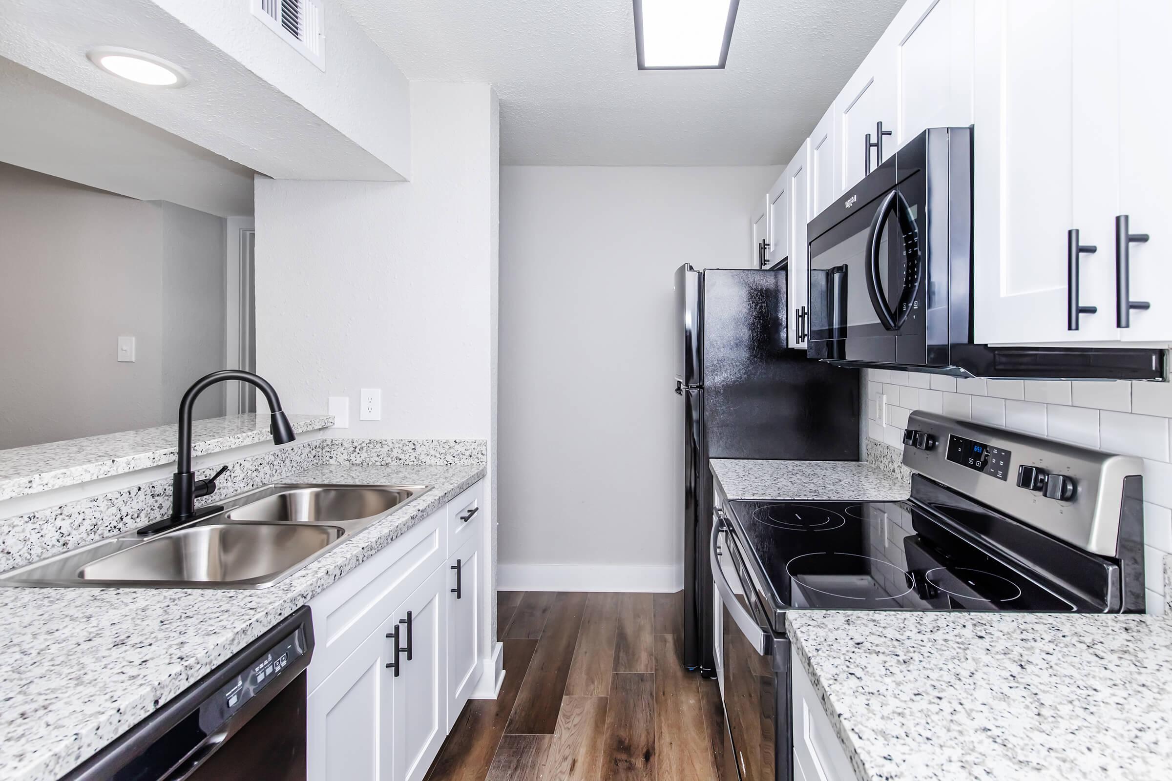 a kitchen with a stove and a sink