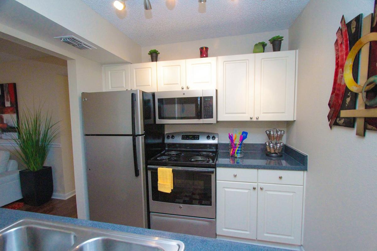 a modern kitchen with stainless steel appliances