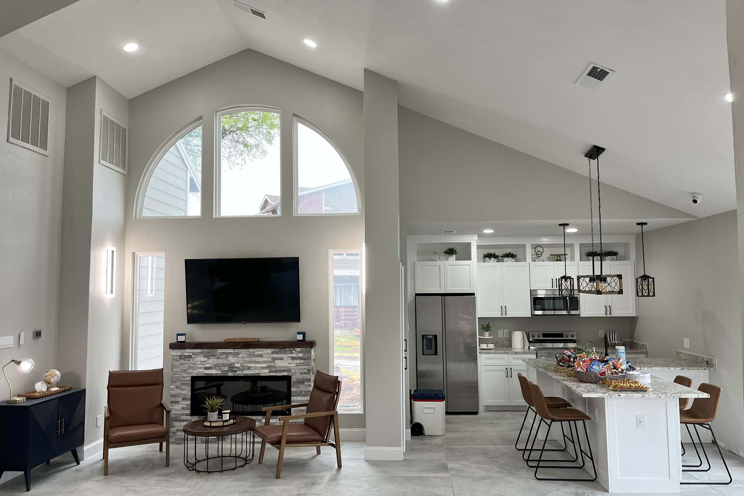 a living room filled with furniture and a fire place